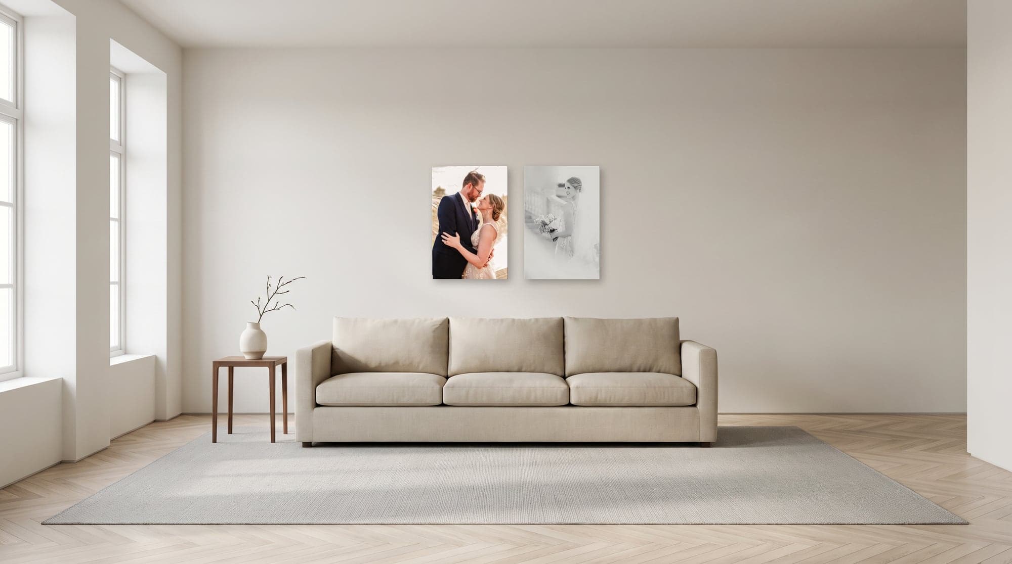 A living room wall above a sofa hung with two 16 by 24 inch gallery-wrapped canvases side by side