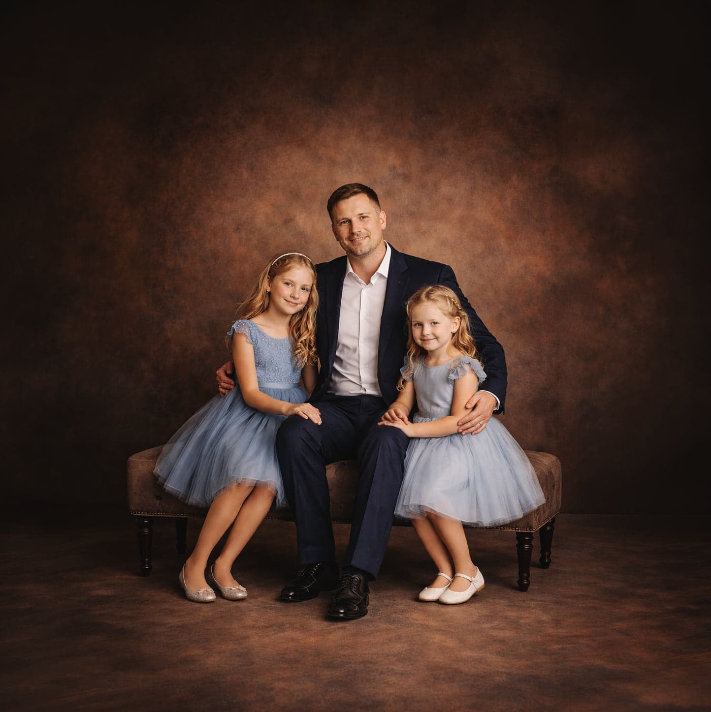 Father and daughters studio portrait