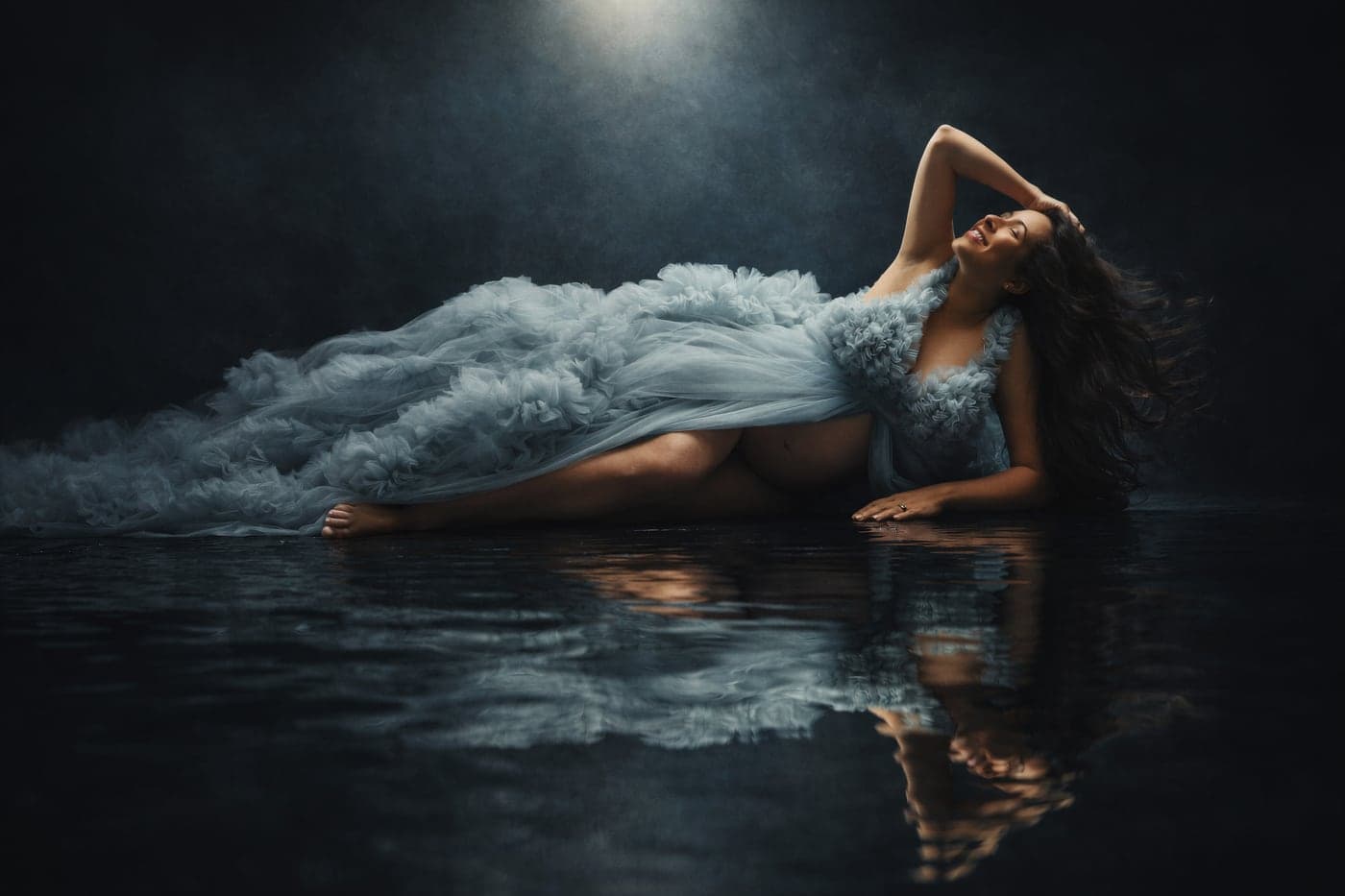 Dusty-blue tulle studio maternity portrait