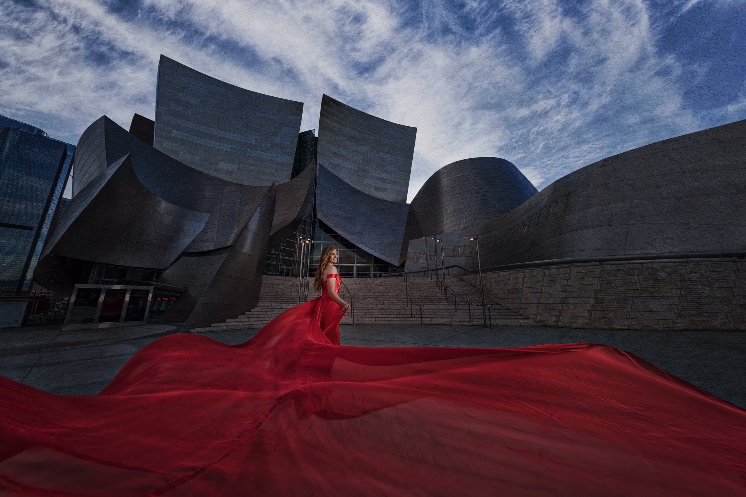 Editorial senior portrait in a red gown at Walt Disney Concert Hall