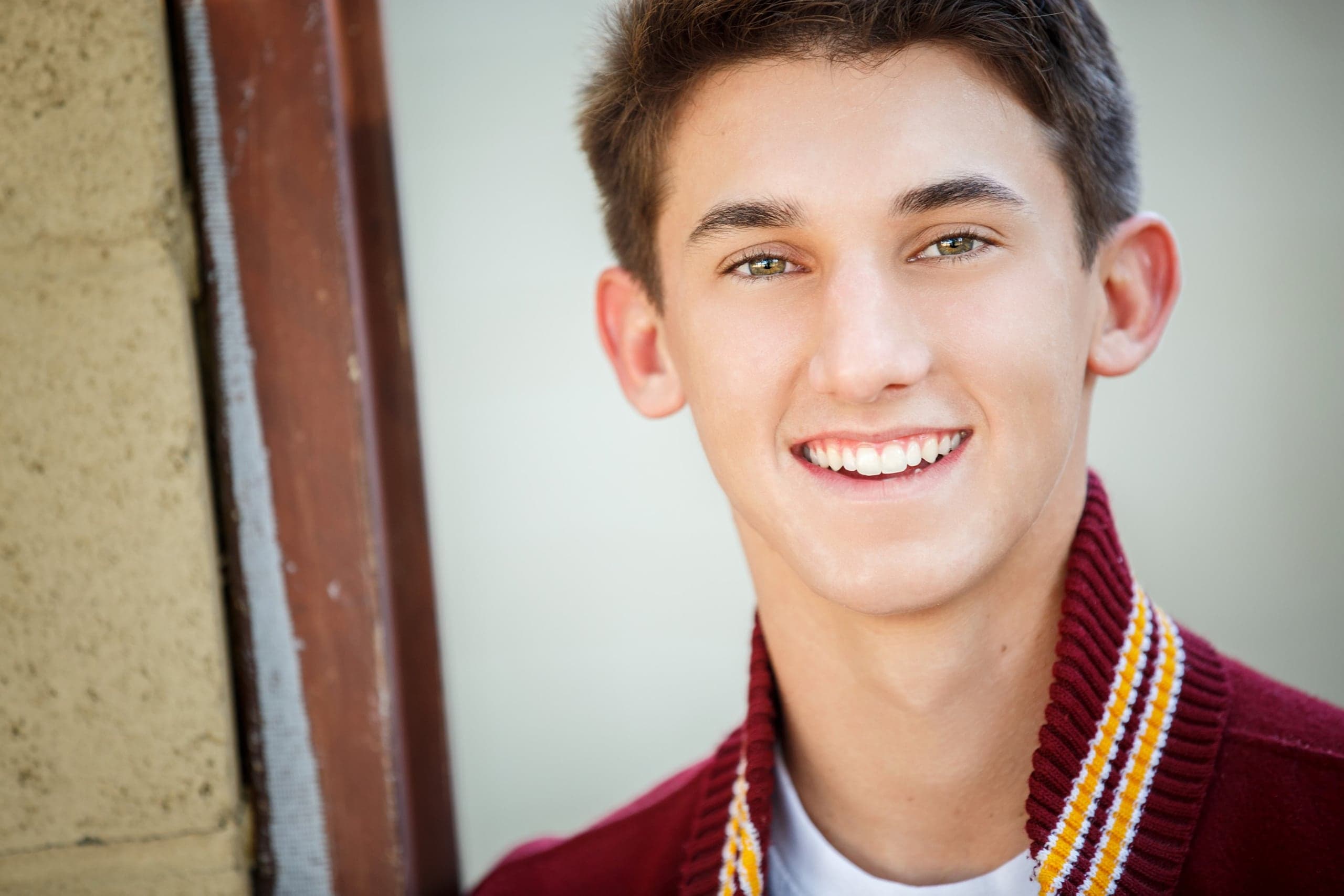 Senior portrait with graduation cords