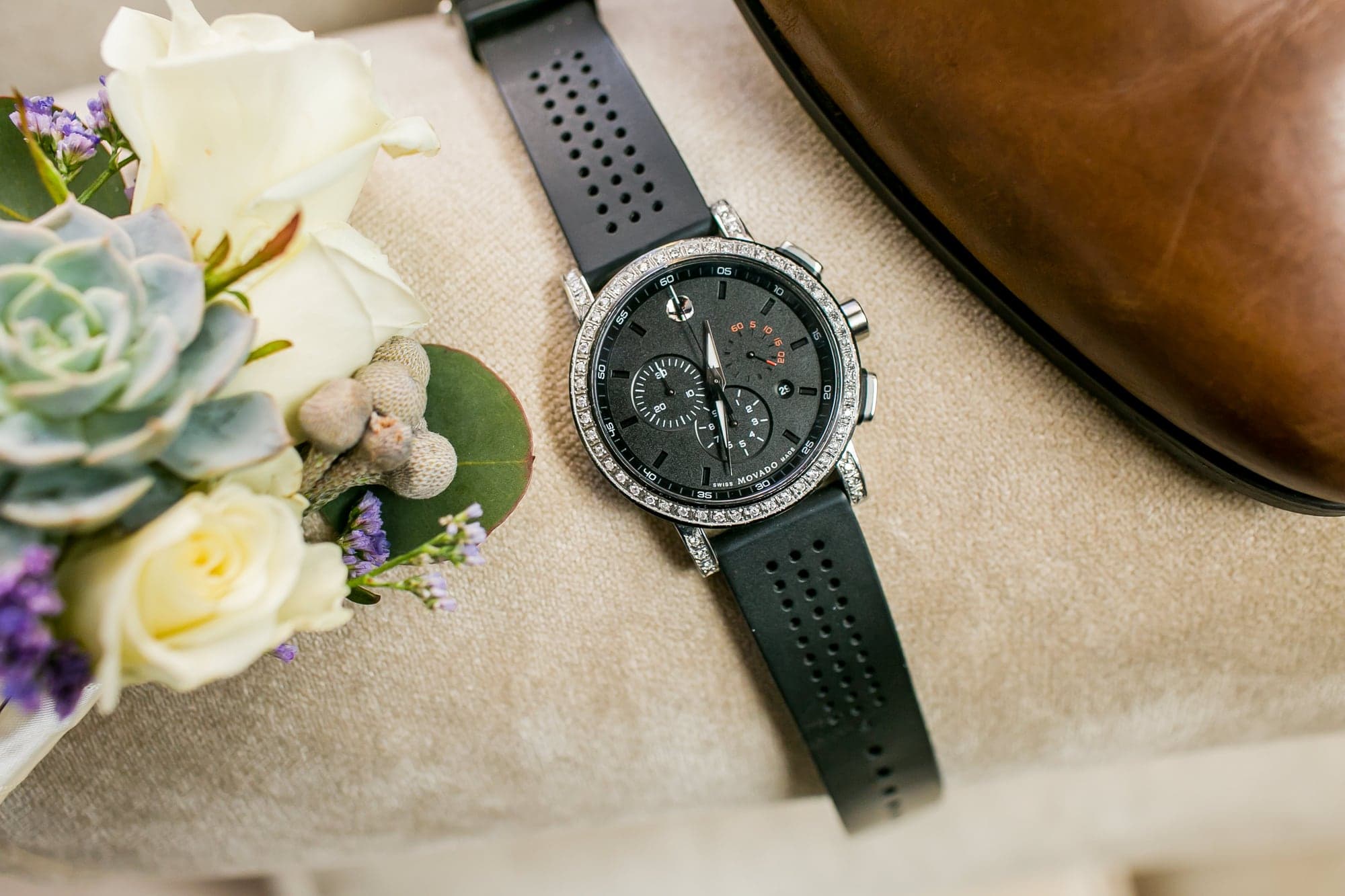 Groom's watch and floral boutonniere before the Phan wedding