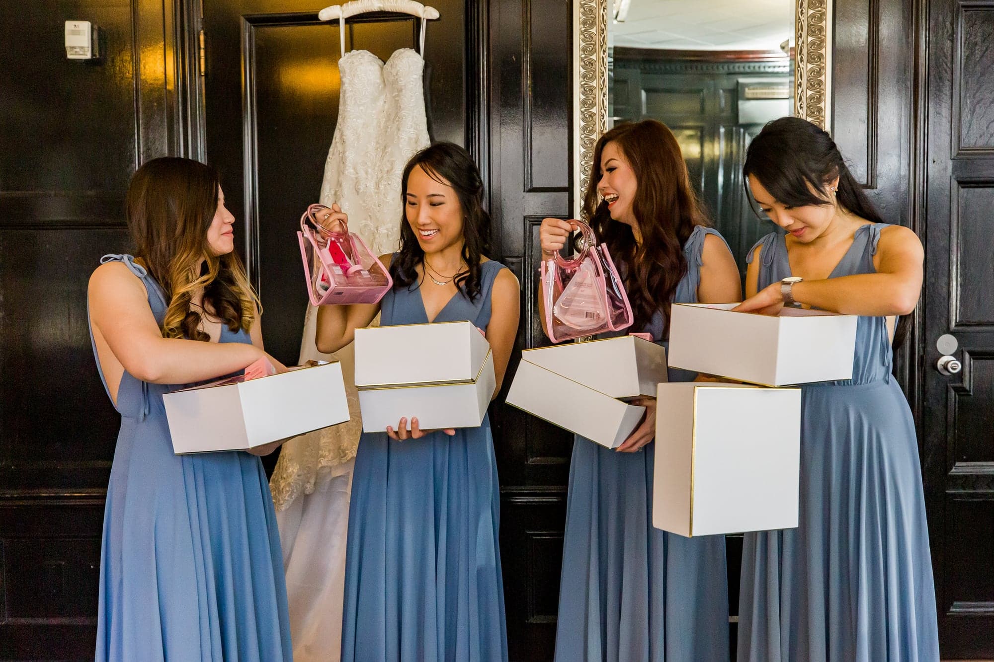 Bridesmaids opening gifts before the ceremony