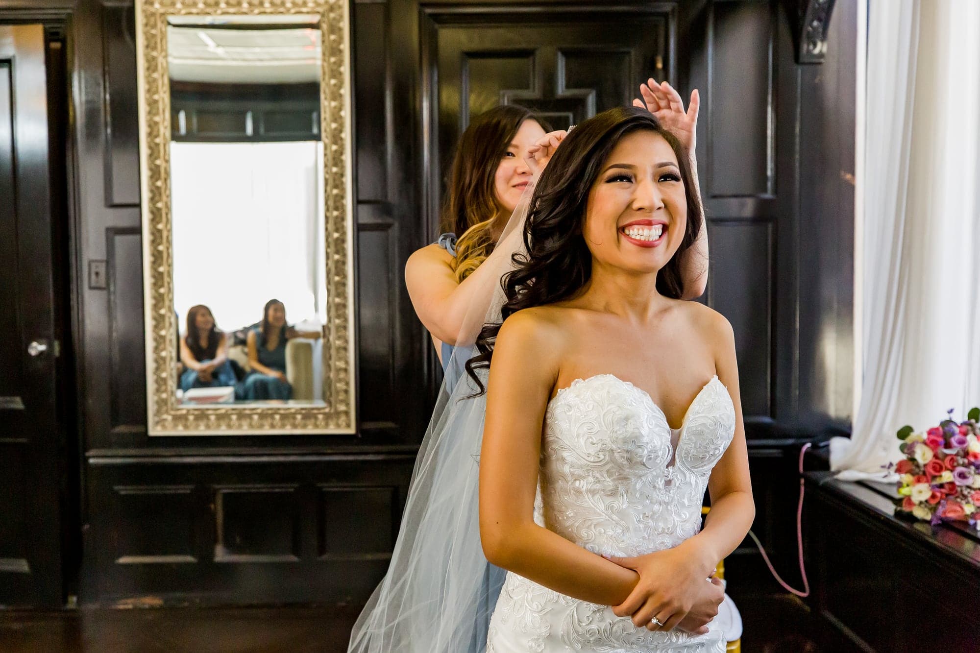 Bride in window light before The Majestic Downtown ceremony