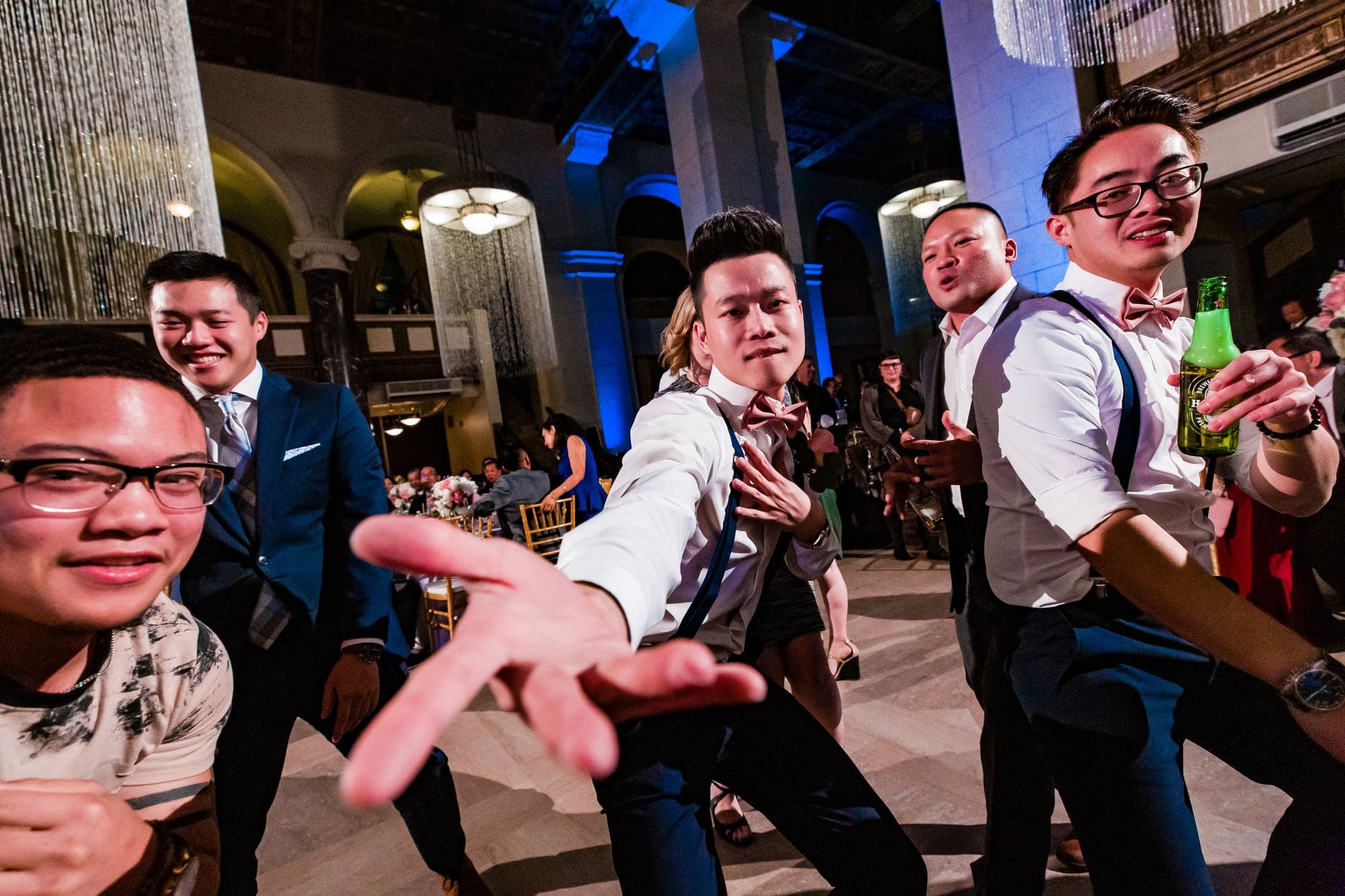 Guests celebrating on the wedding dance floor