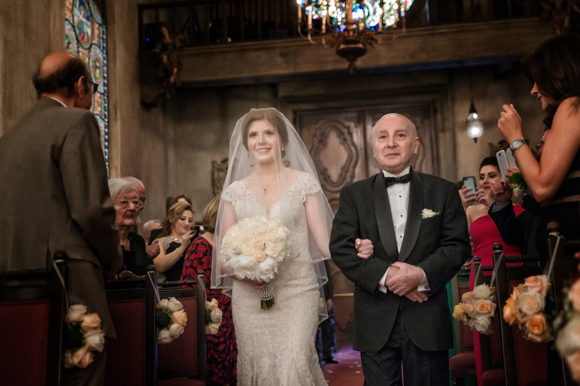 Bride entering the ornate church for the wedding ceremony