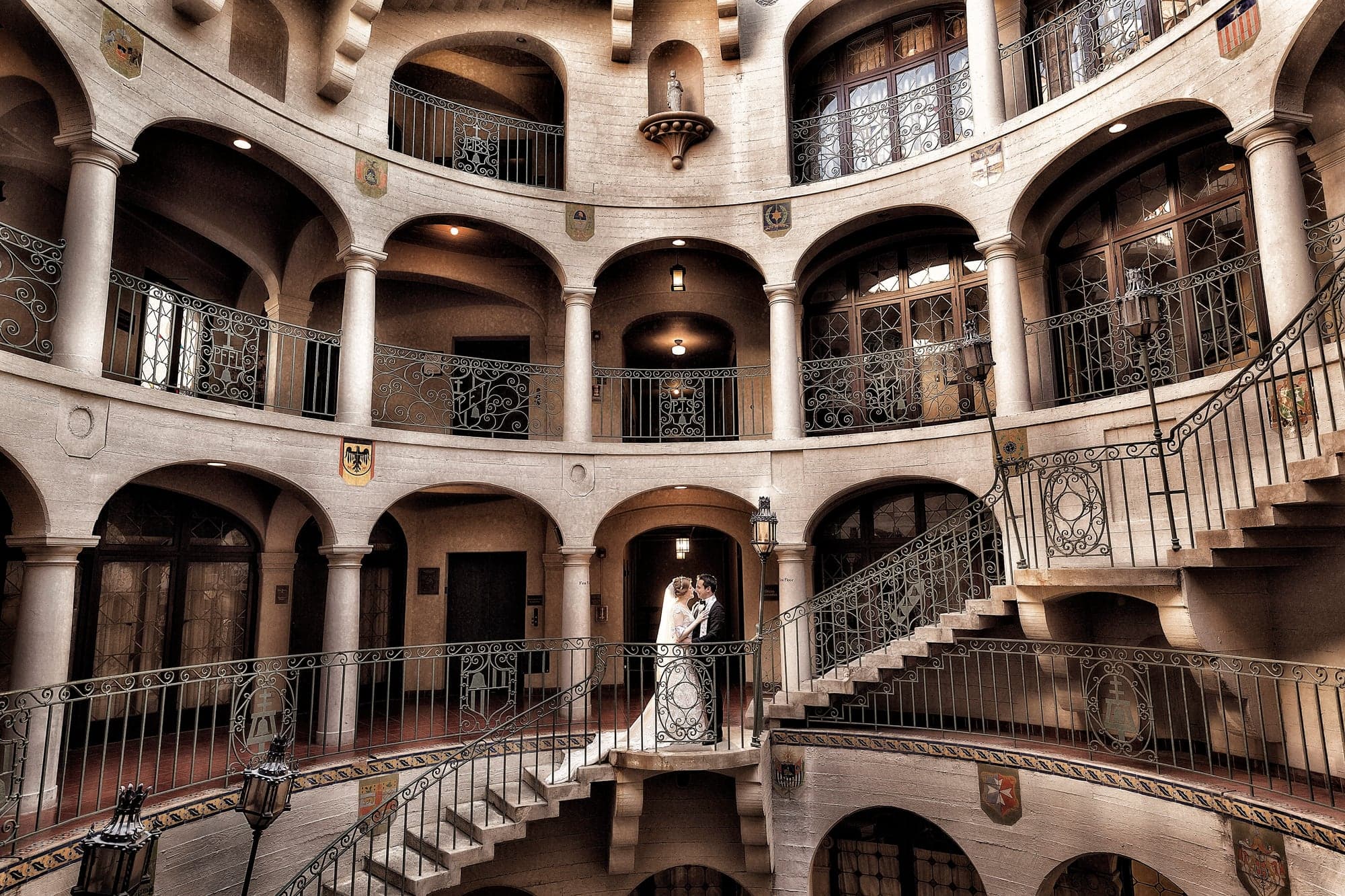 Wedding couple in a historic Mission Inn courtyard