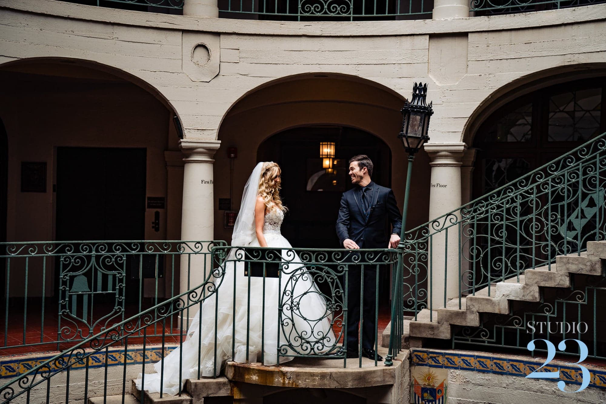 Wedding couple on a Mission Inn balcony