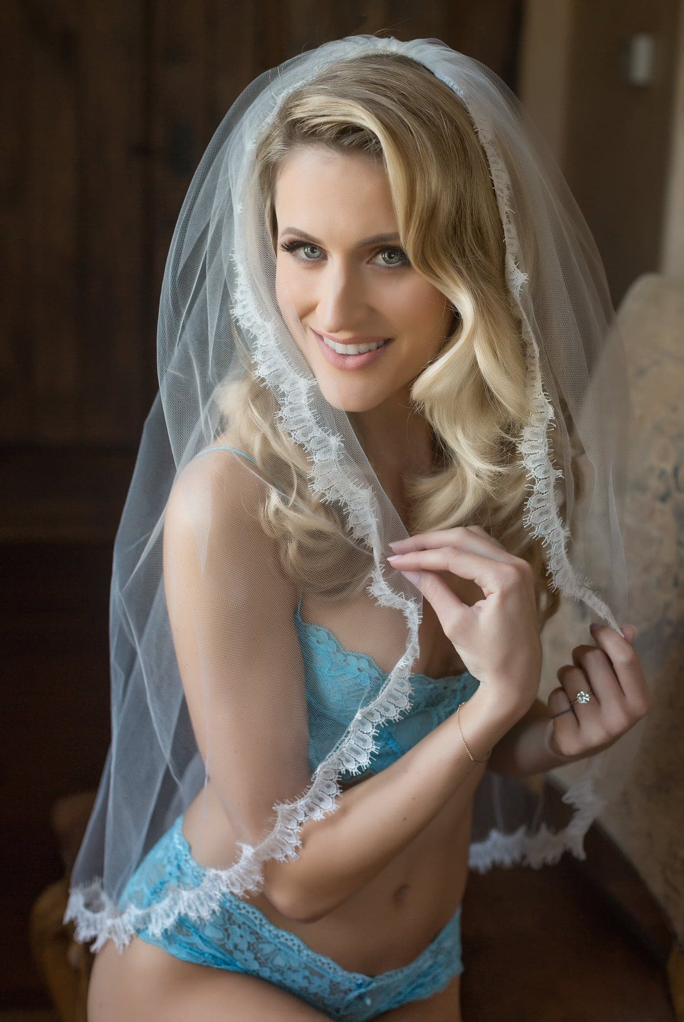 Bride adjusting her veil before the Marino wedding