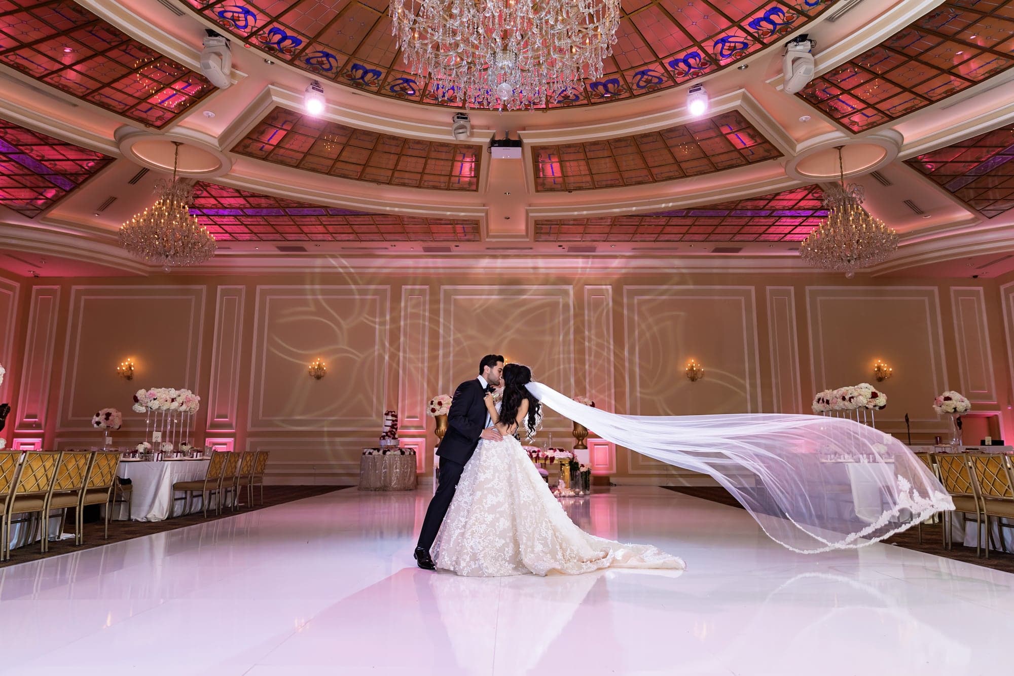 Mary and Fady beneath a flowing veil inside Taglyan Complex
