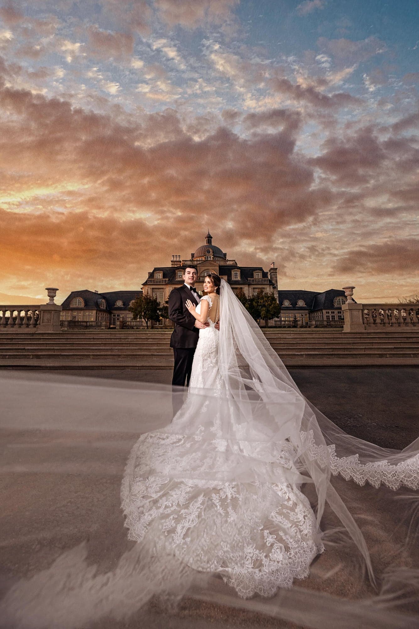 Couple at golden hour on the grand lawn of The Olana estate