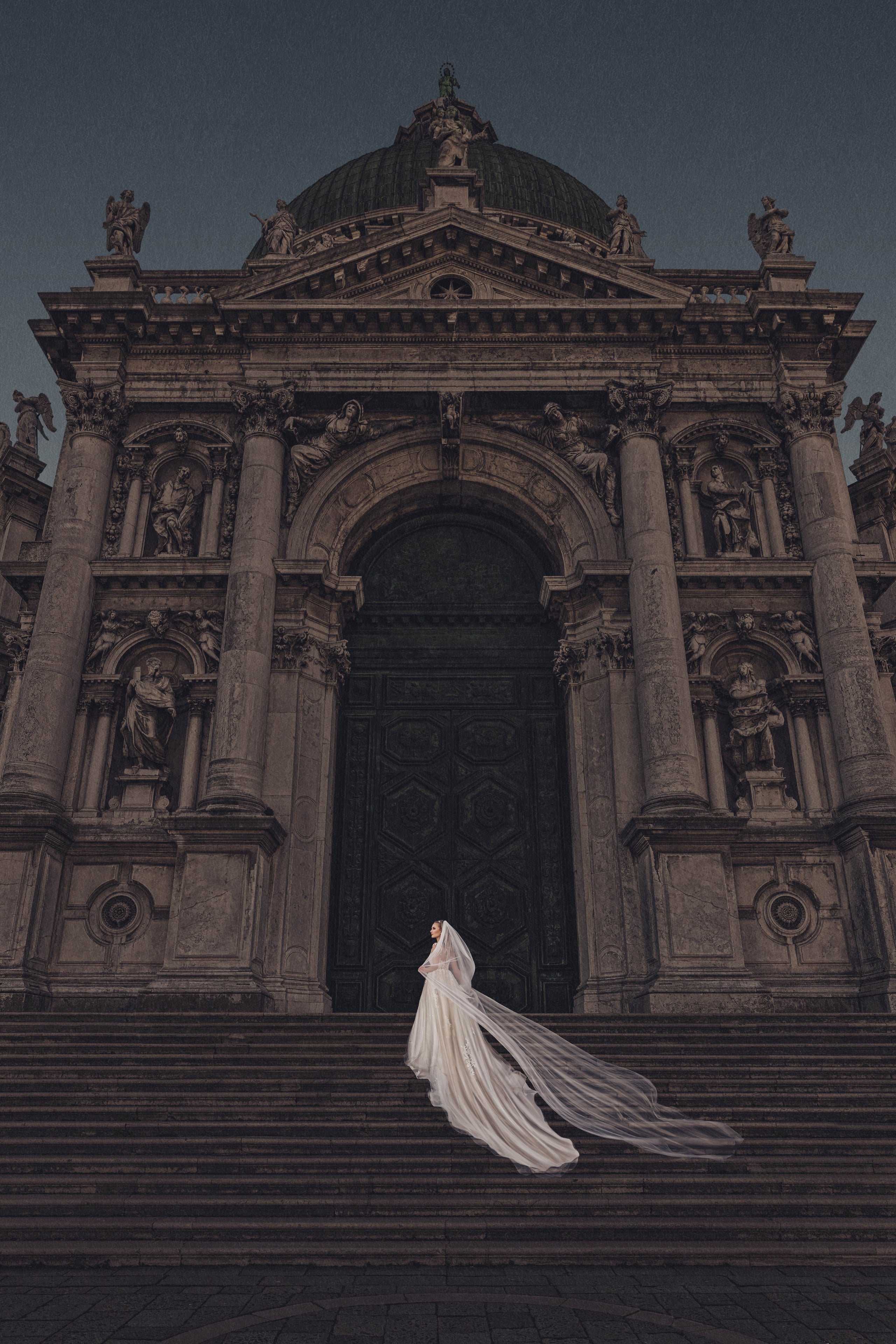 Bride descending the steps of an ornate Venetian church