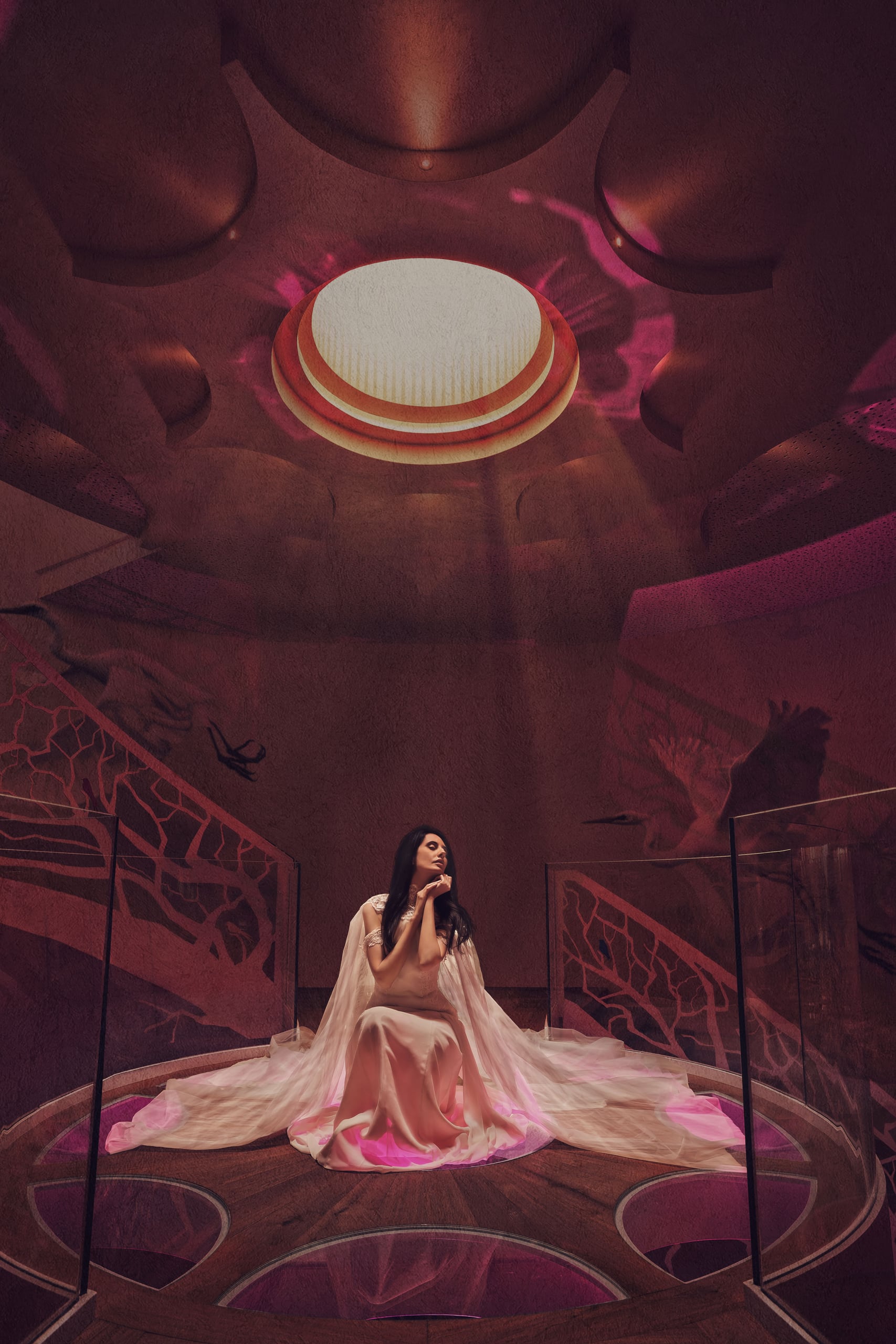A bride beneath a crimson cathedral ceiling