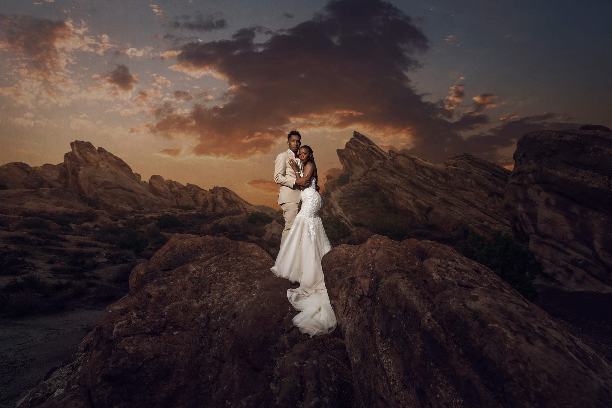 a bride and groom on the rock formations at Vasquez Rocks, after retouching