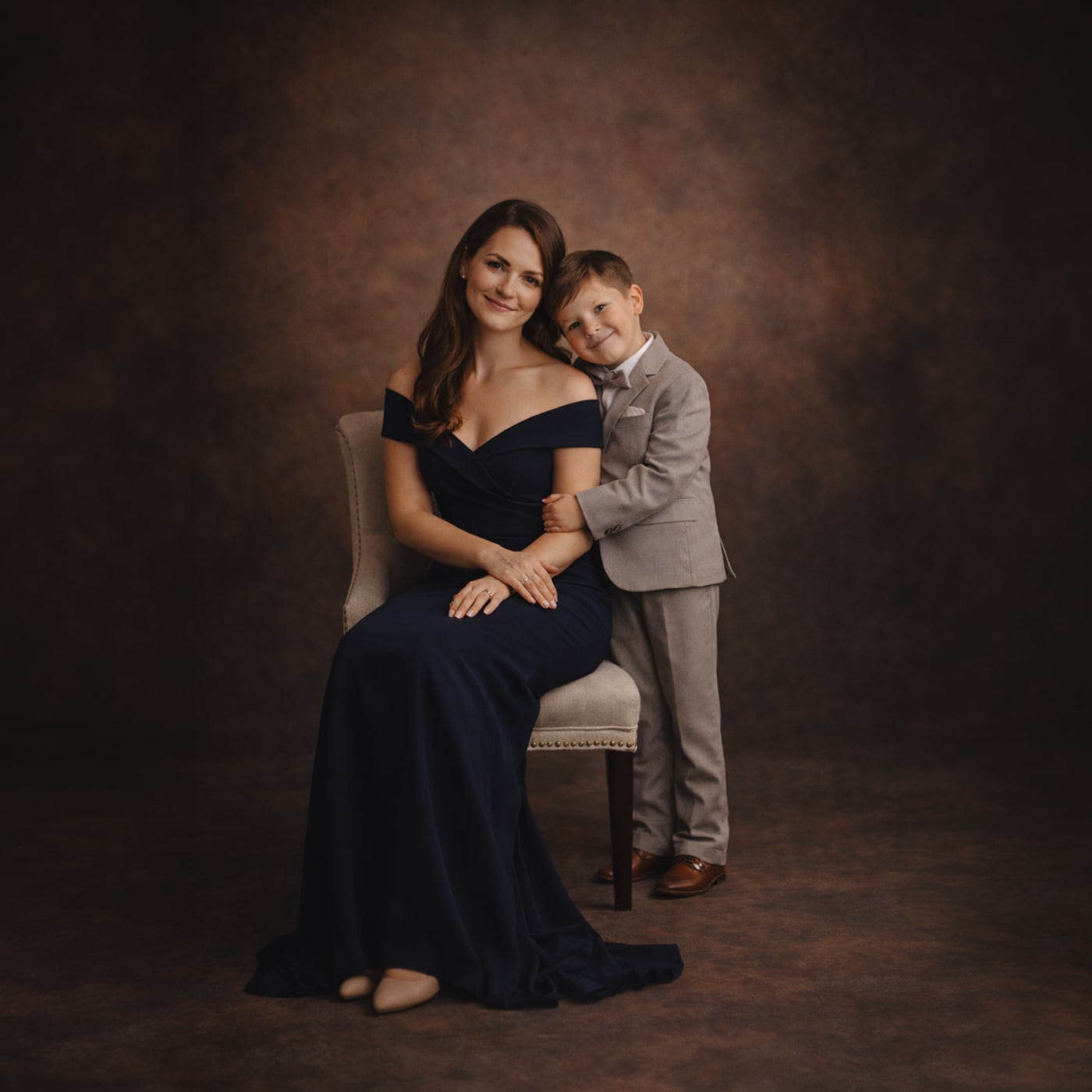 Mother and son in a fine-art studio portrait