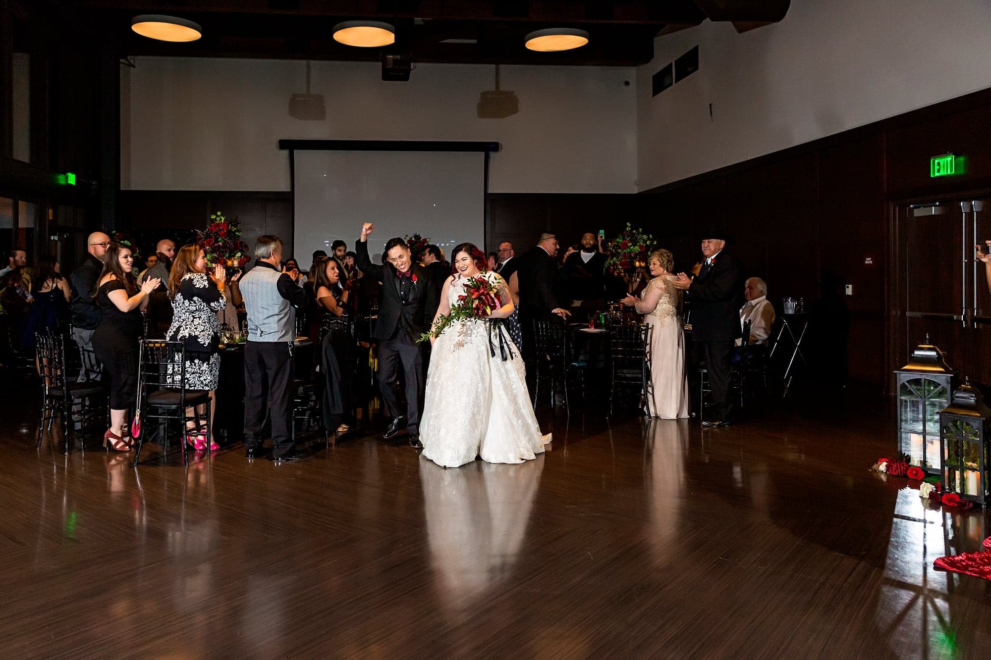 Melissa and Alejandro entering their reception