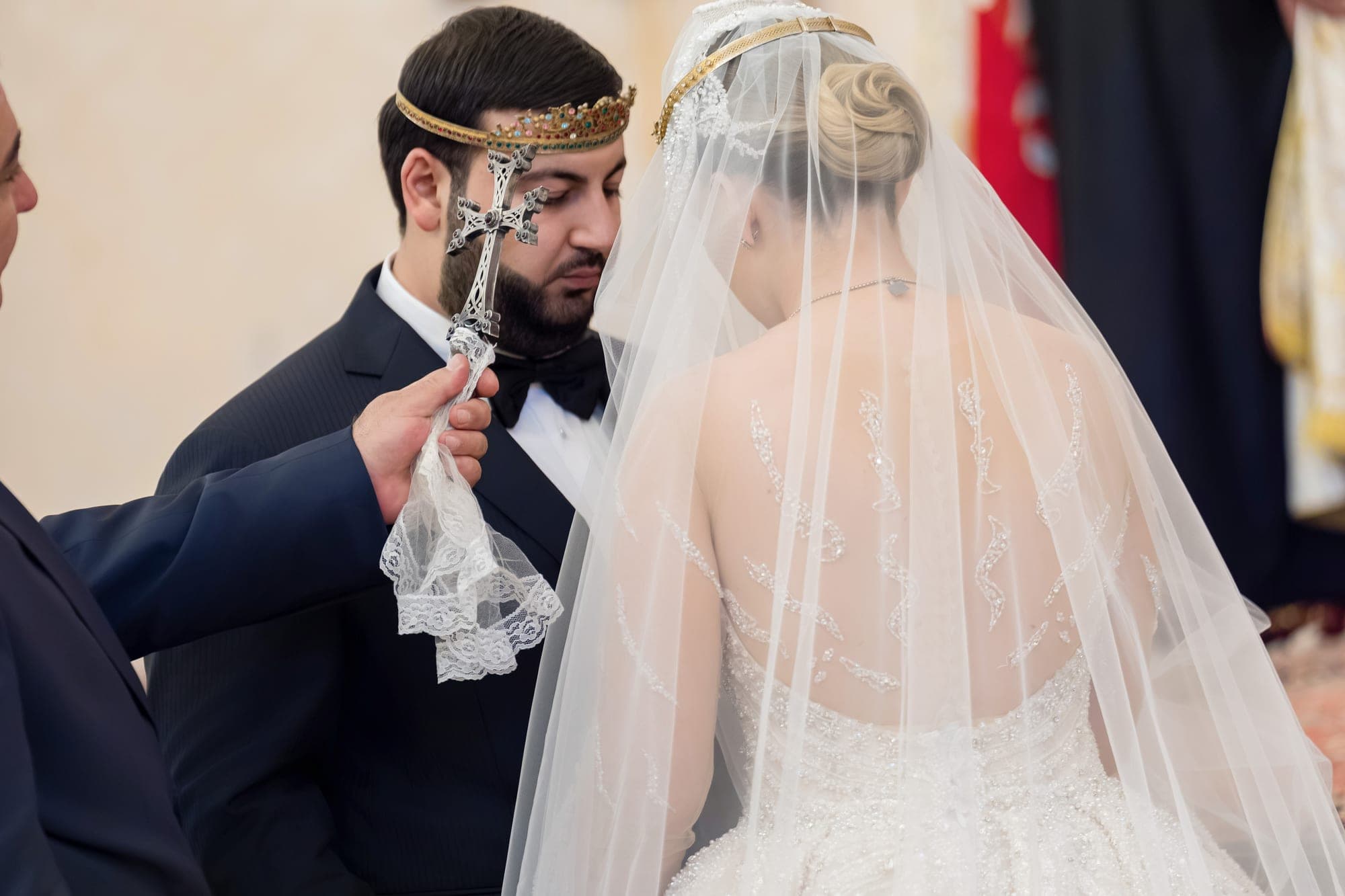 The Armenian crowning ceremony, the couple crowned and joined beneath a silver cross