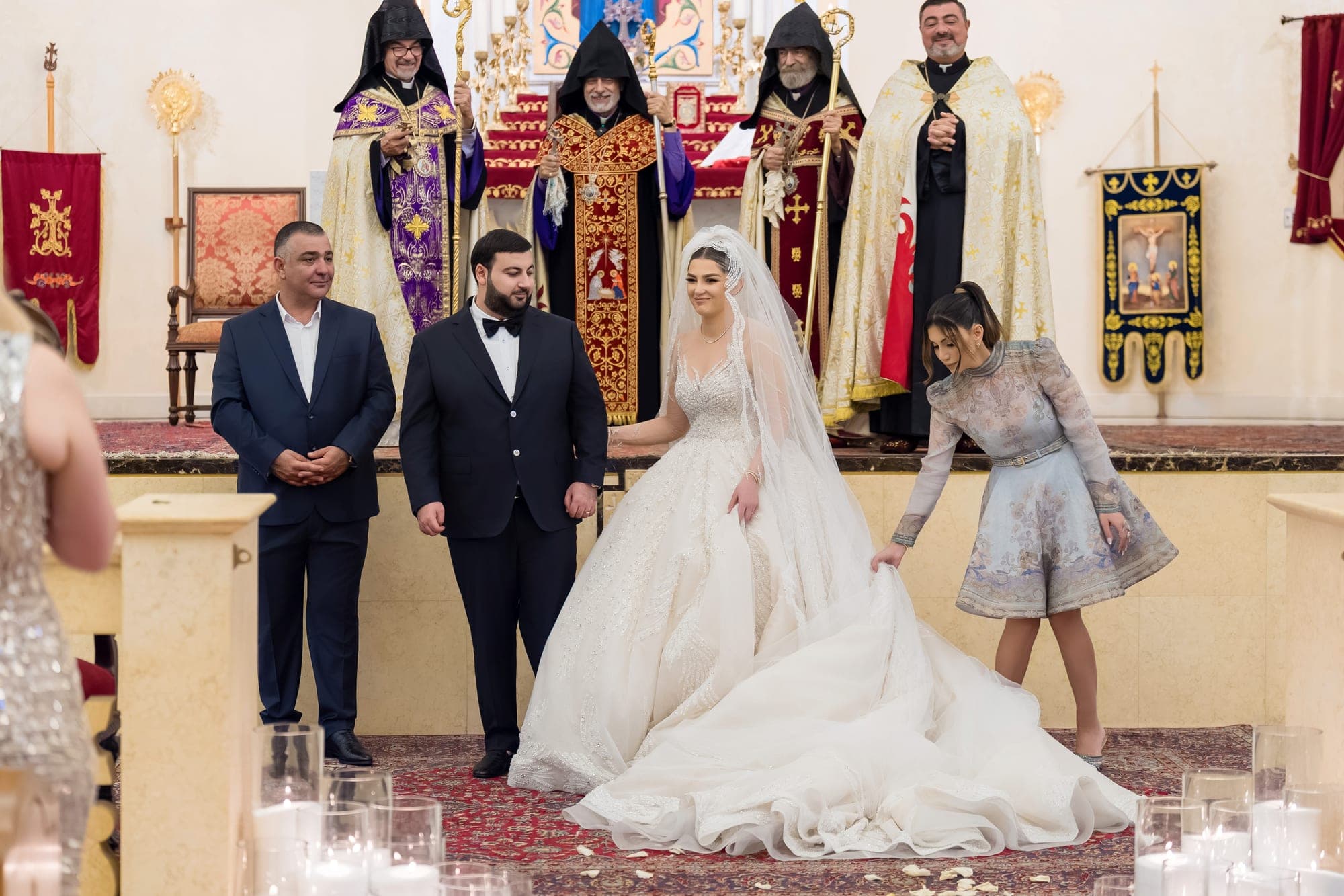 The bride and groom before the altar with Armenian clergy in full vestment