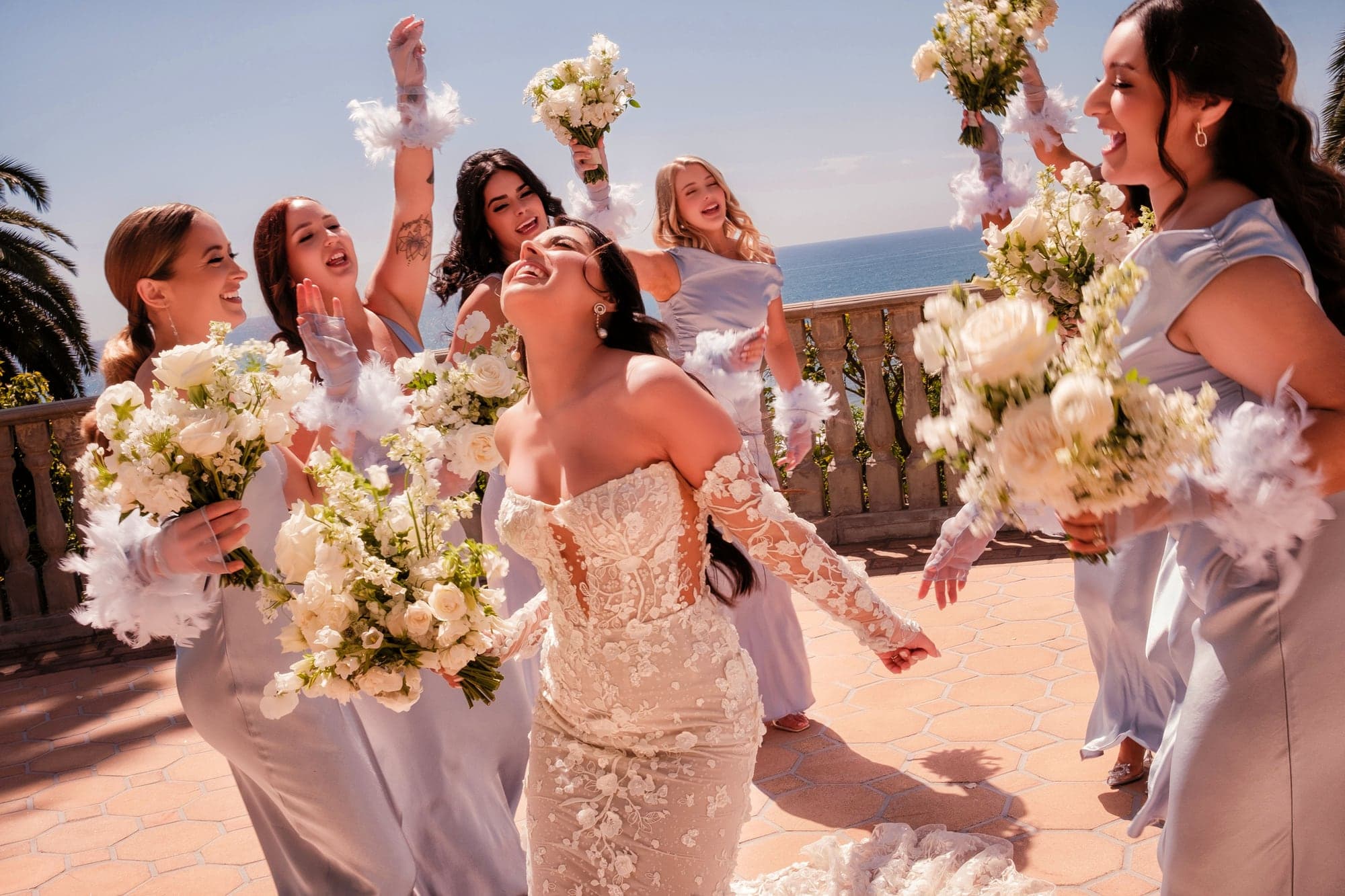 Kaitlan celebrating with her bridesmaids on the ocean terrace