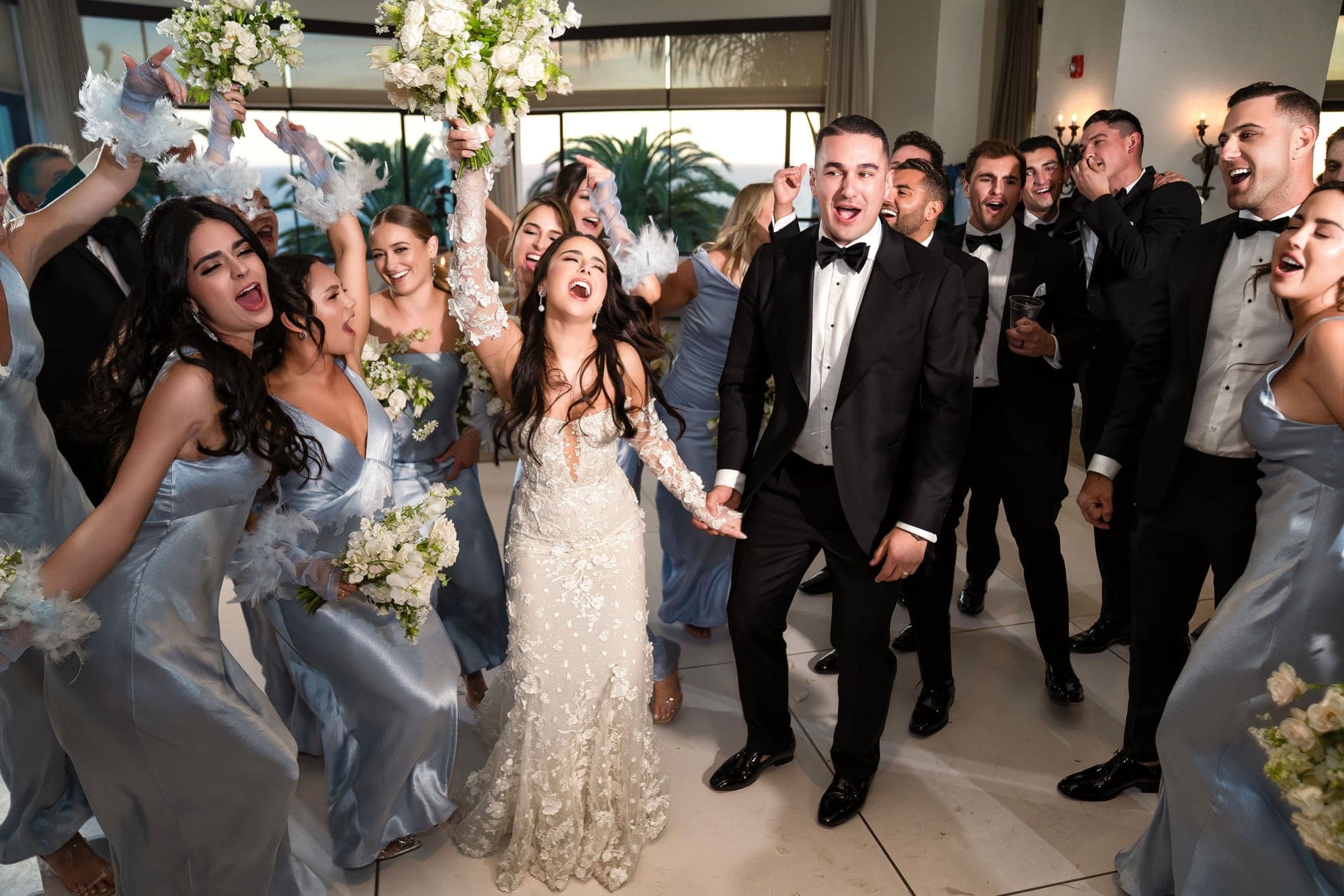 Kaitlan and James celebrating with guests on the reception dance floor