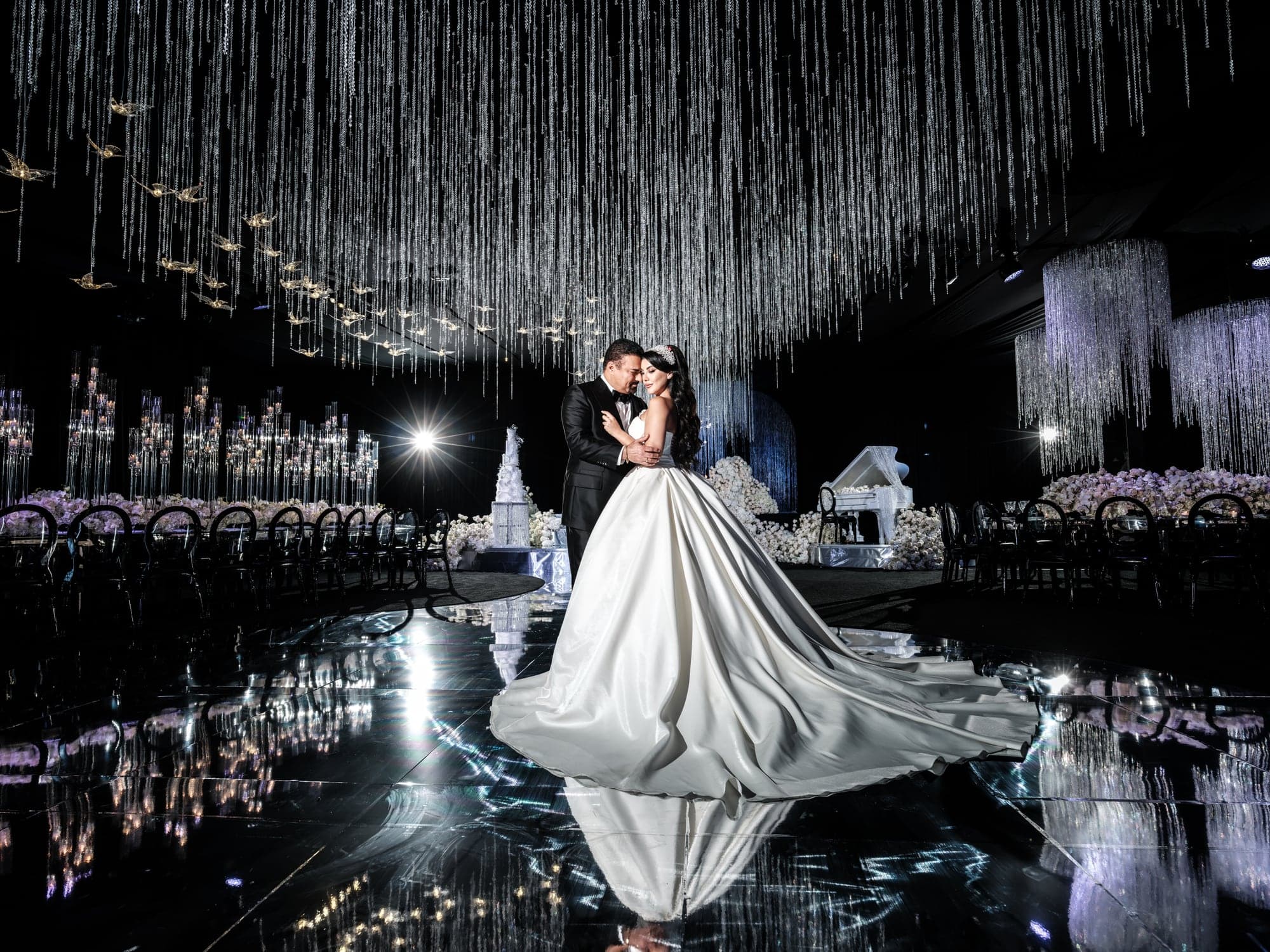 Ghazal turning on the reflective dance floor beneath the ballroom's crystal installation