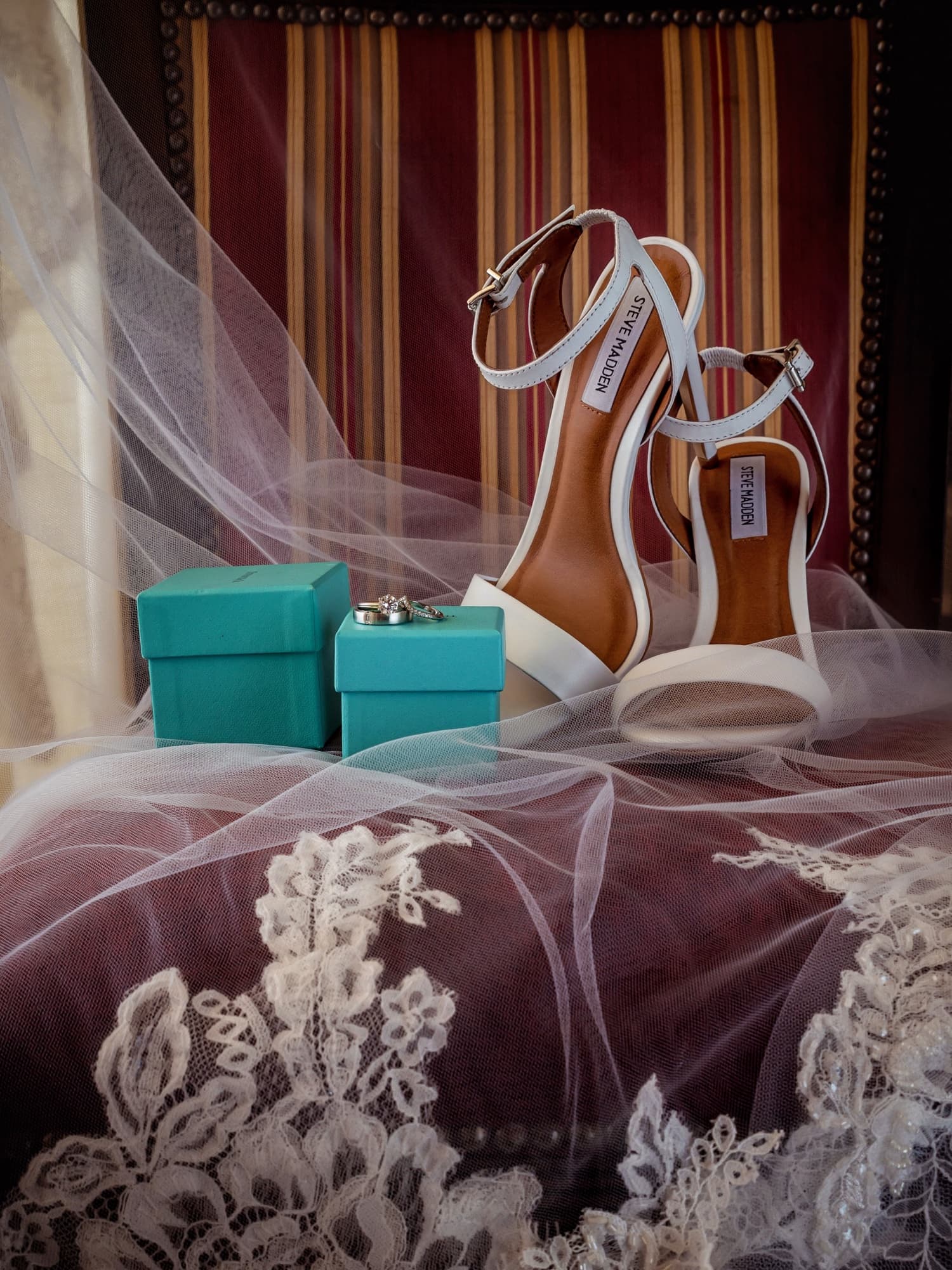 Kirsten's Steve Madden bridal heels staged with Tiffany-blue boxes on her lace veil at Grand Solmar in Cabo