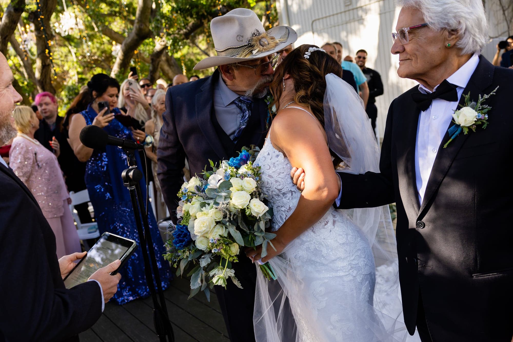 Mazl walking into the Oak Room ceremony with family as Arthur watches