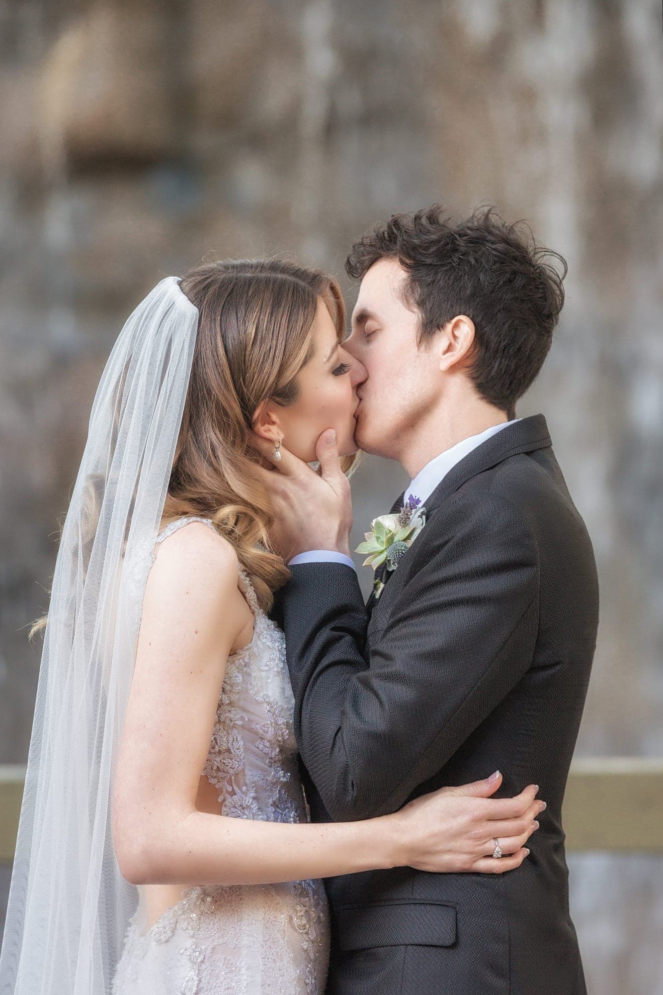 Newlyweds kissing after their Oak Room ceremony