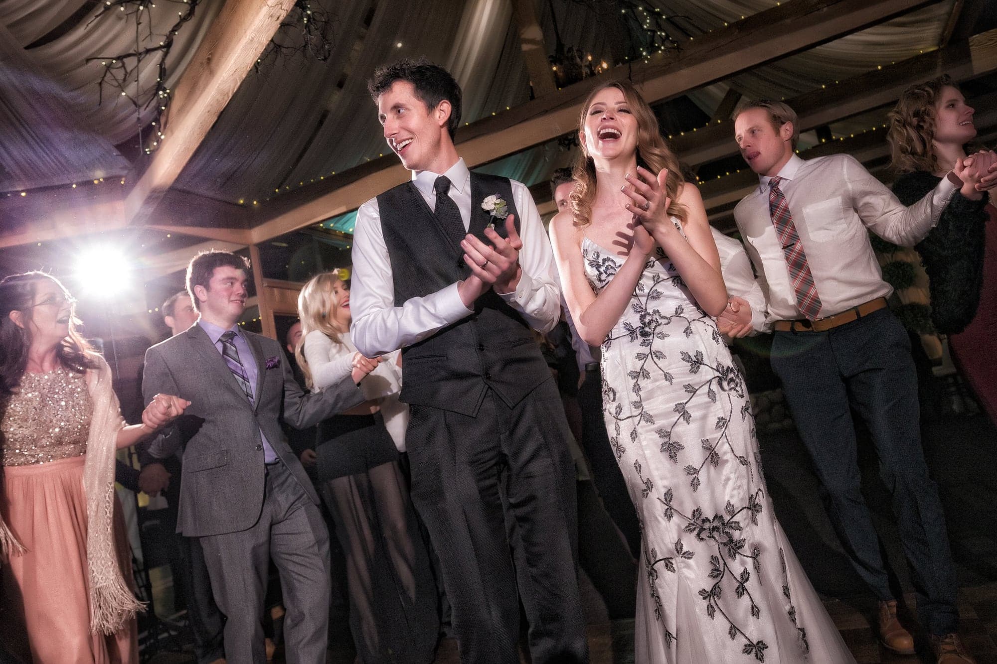 Wedding guests celebrating during the reception