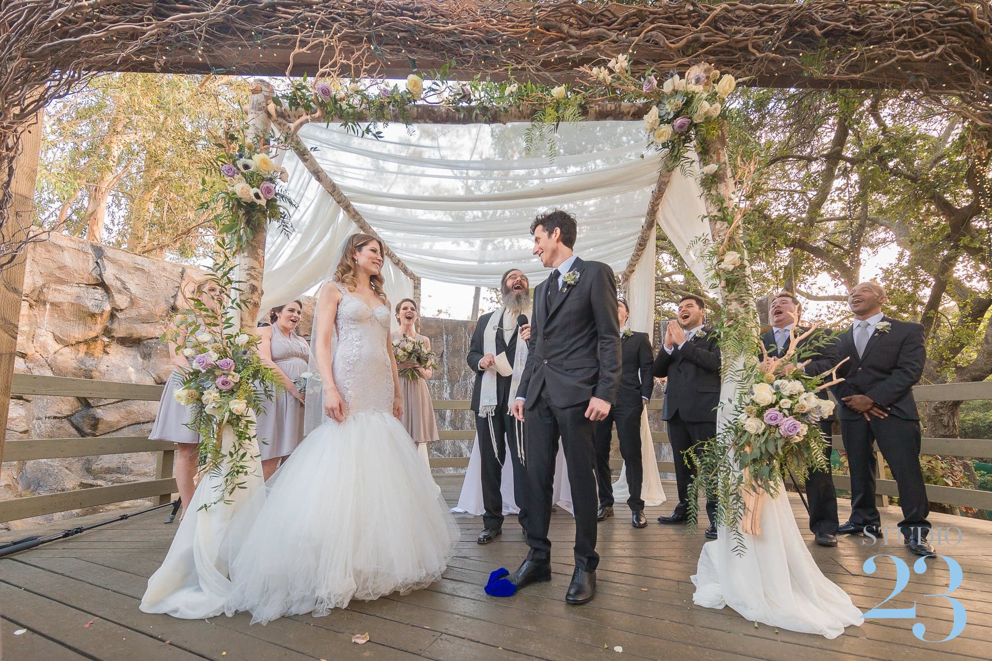 Newlyweds walking into their reception