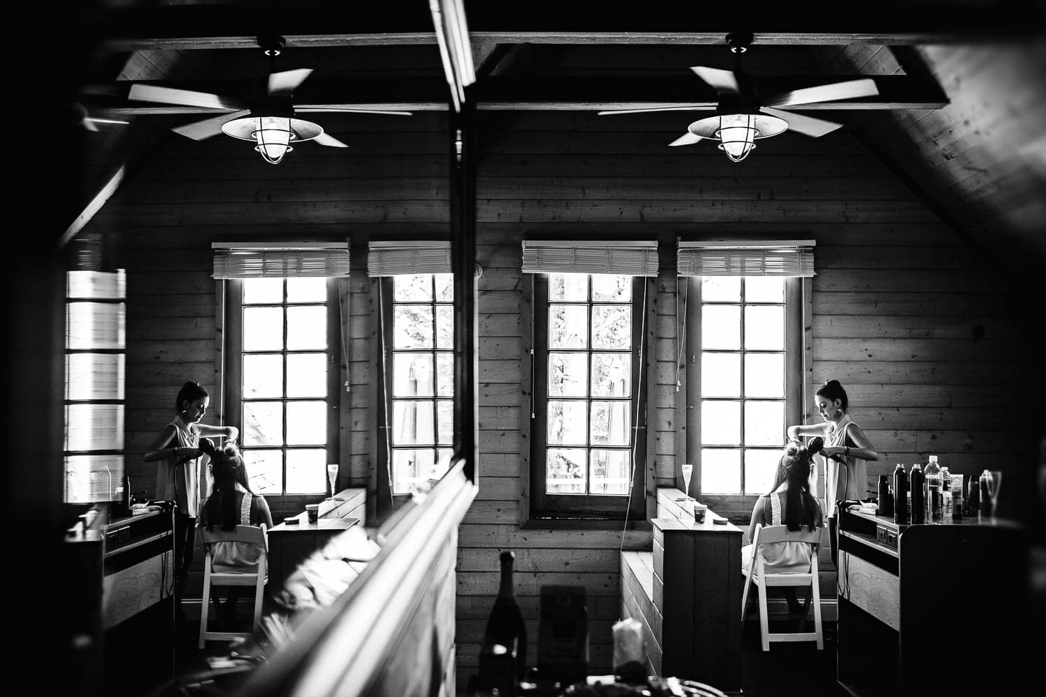 Kelly preparing in window light before her Calamigos Ranch wedding