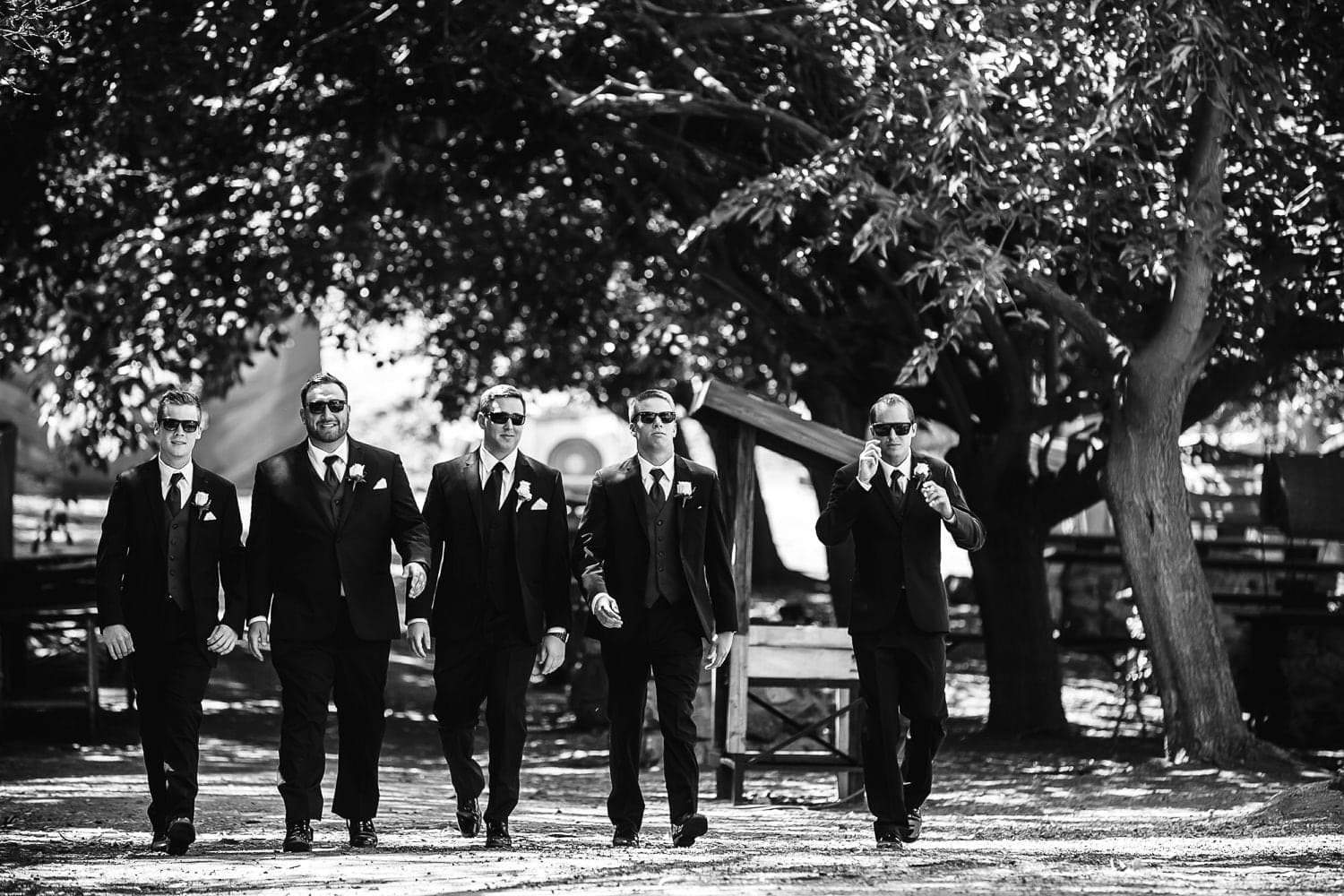 John with his wedding party beneath the Calamigos Ranch trees
