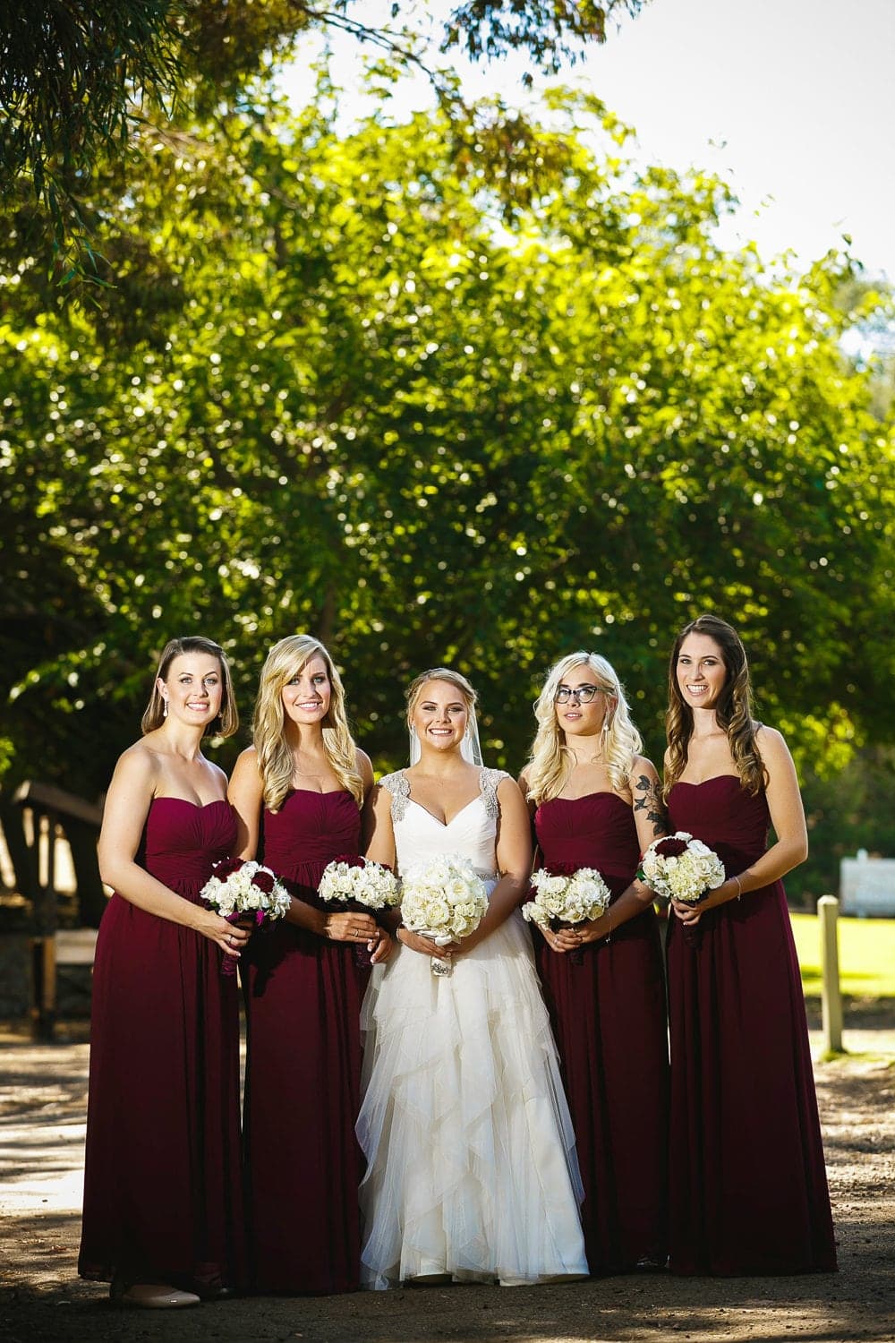 Kelly with her burgundy dressed wedding party