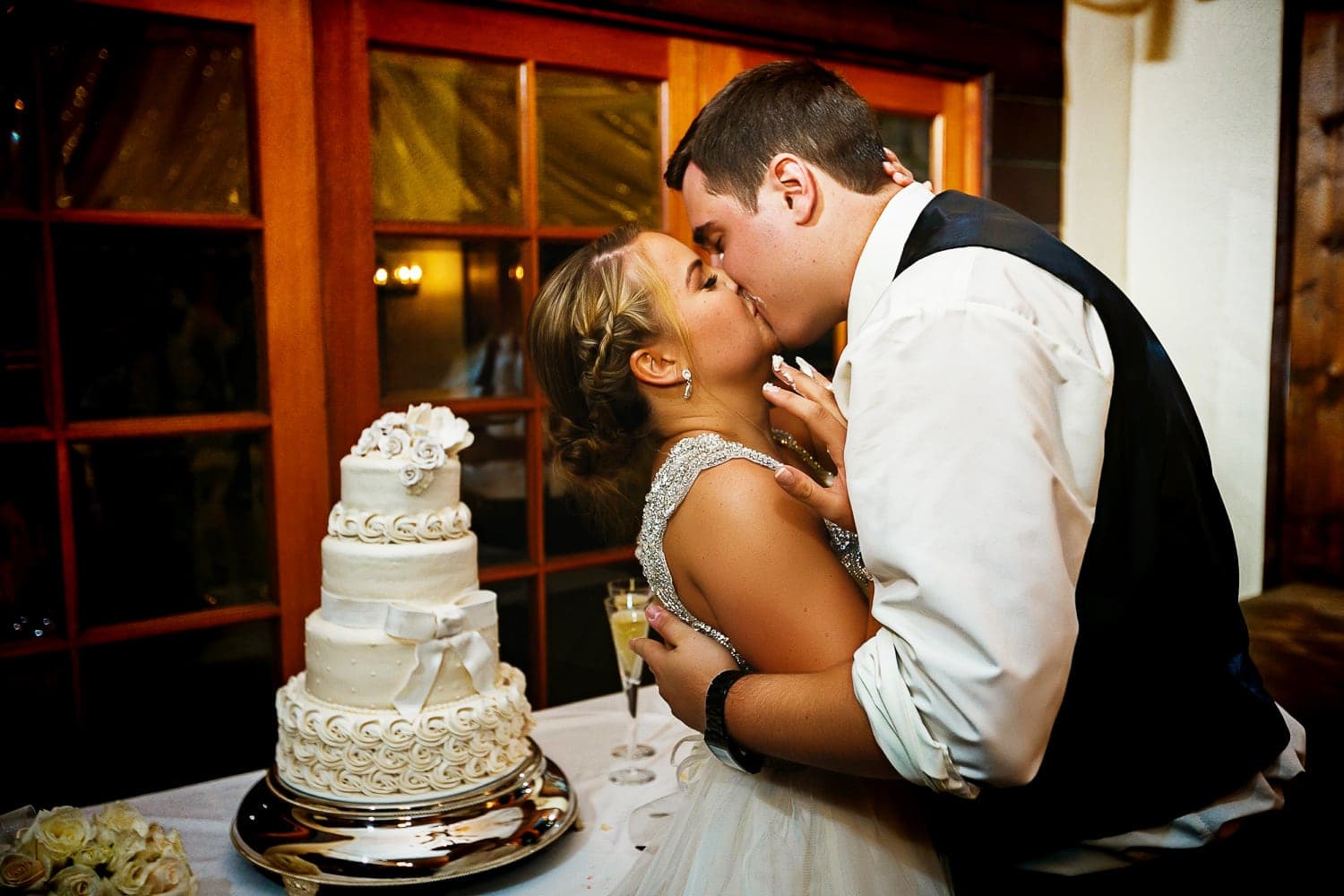 Kelly and John cutting their wedding cake