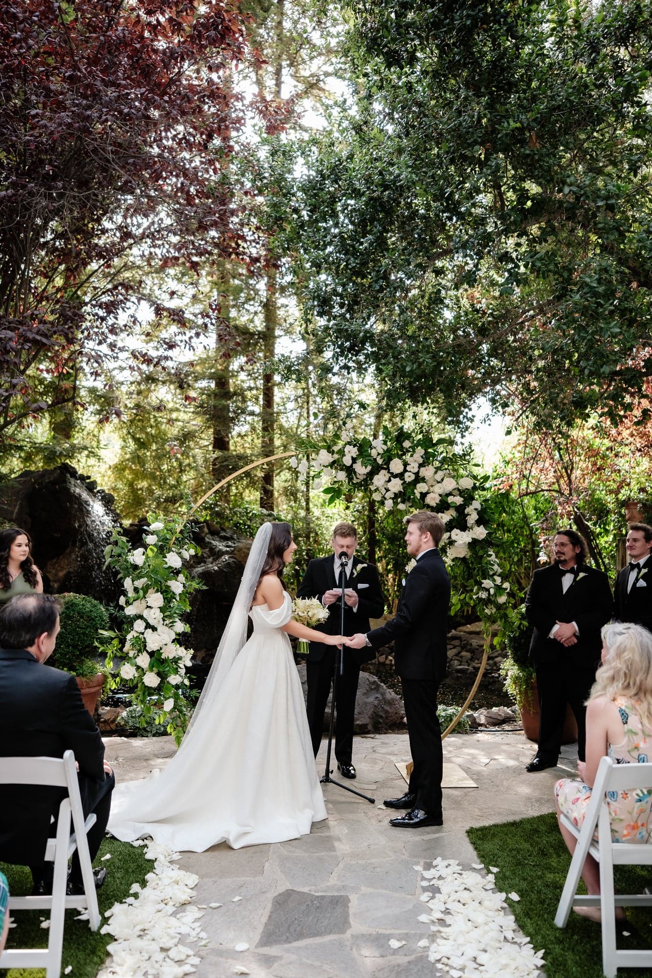 Alexander watching his bride during their garden ceremony at Calamigos Ranch