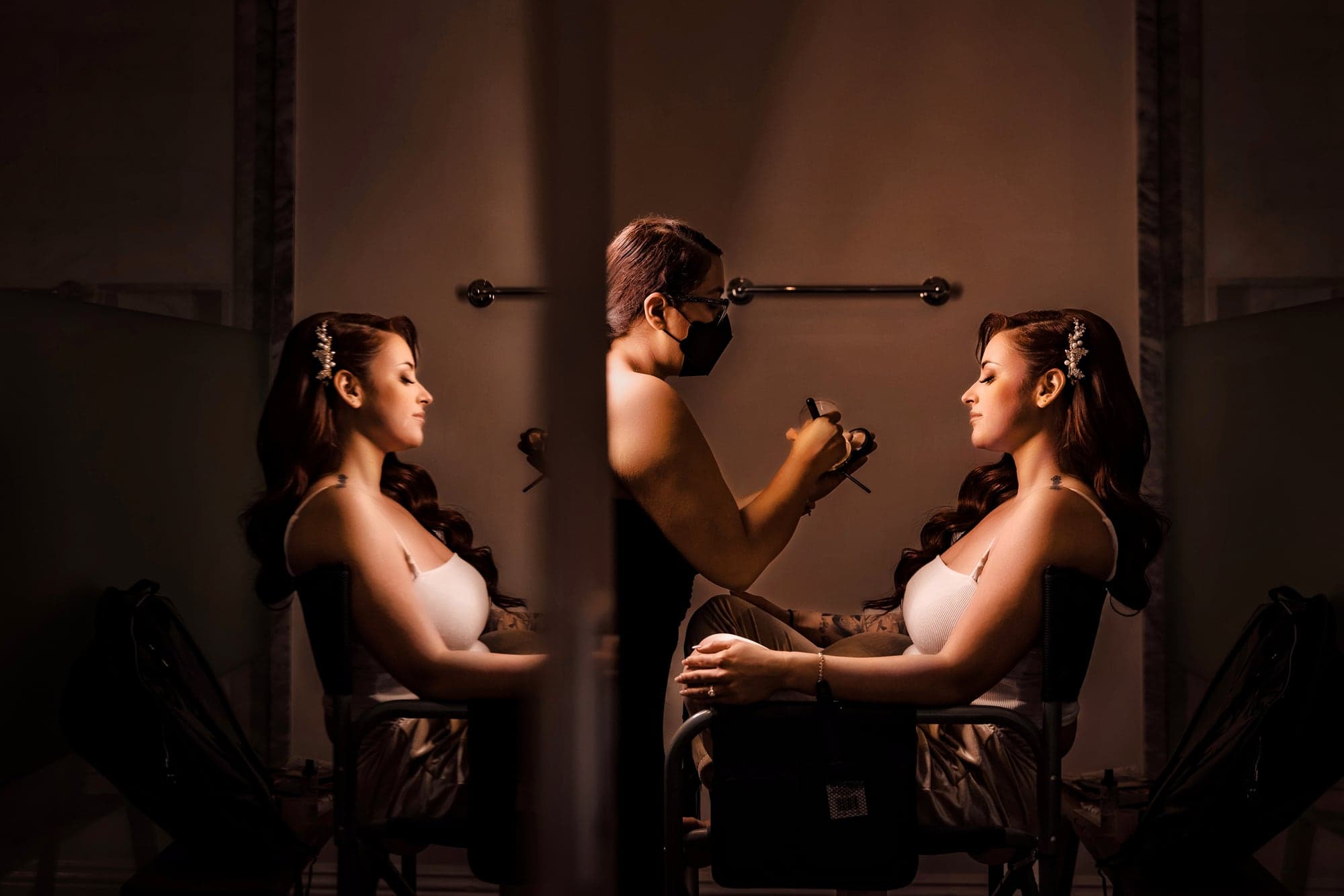 Gina having her makeup finished in dramatic window light at Calamigos Ranch