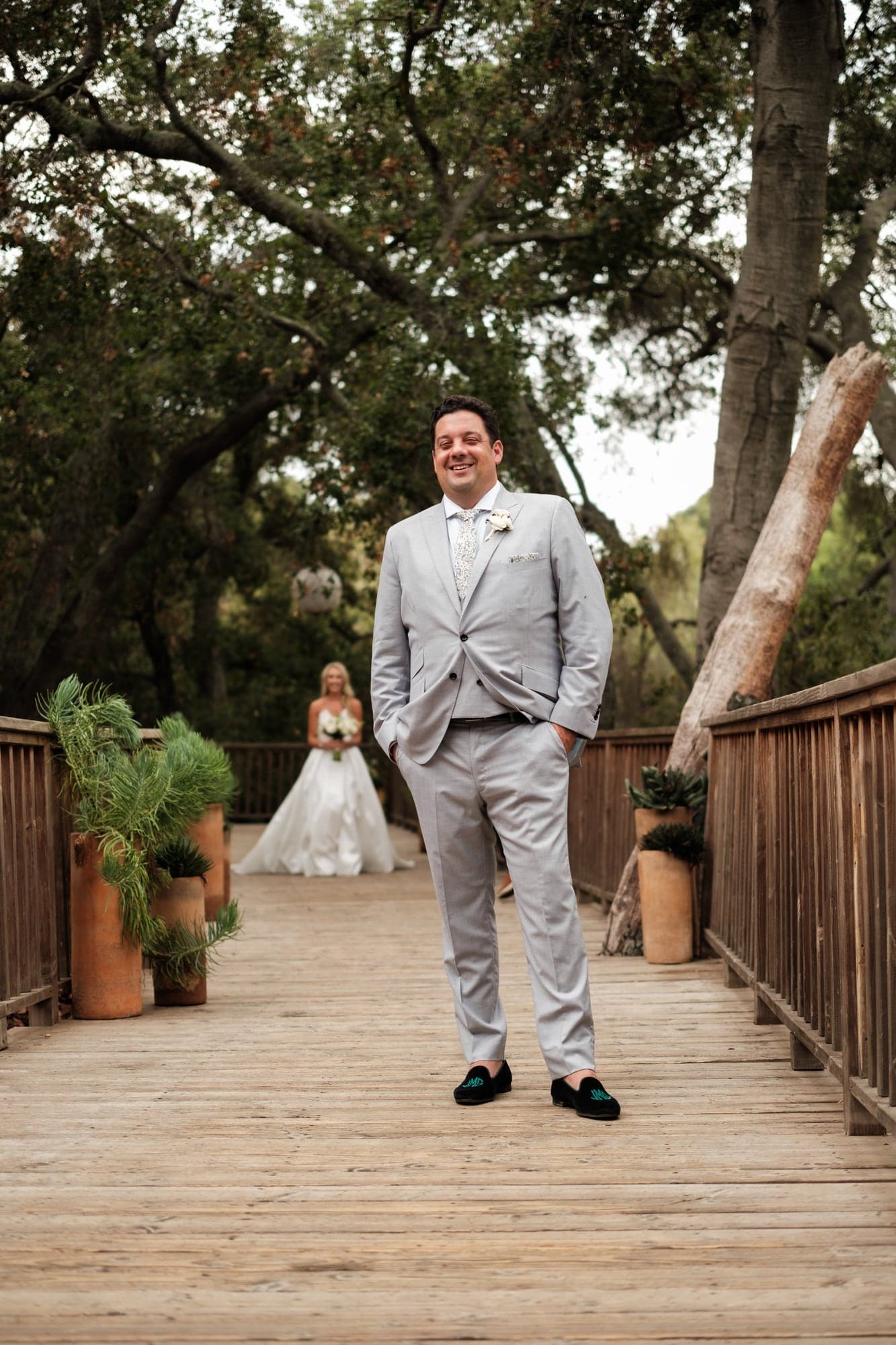 Karolina and Jonathan sharing a portrait along the wooded paths at Calamigos Ranch