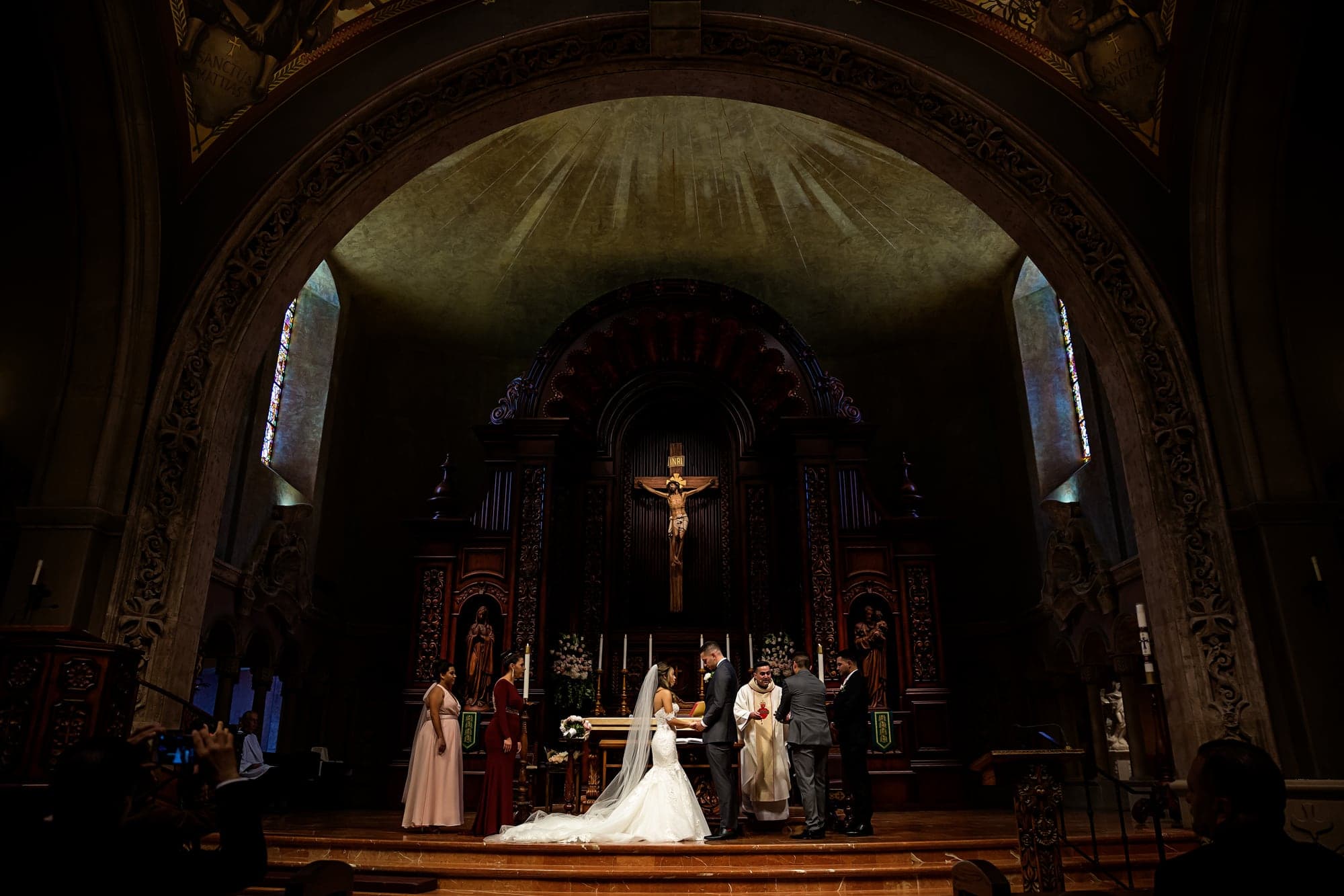 Jennifer and Bryan at the altar during their wedding ceremony
