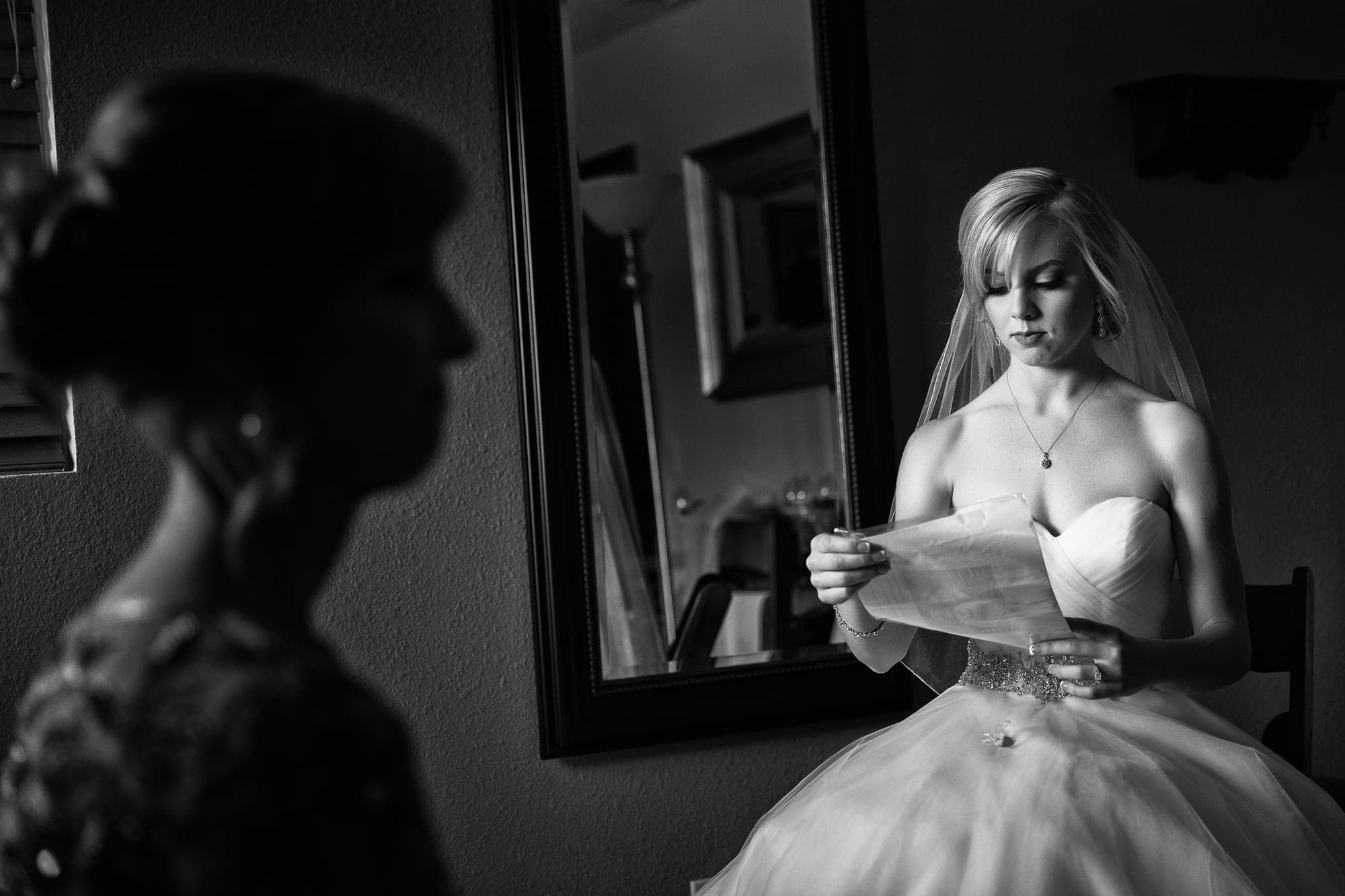 Krista reading a letter before the wedding