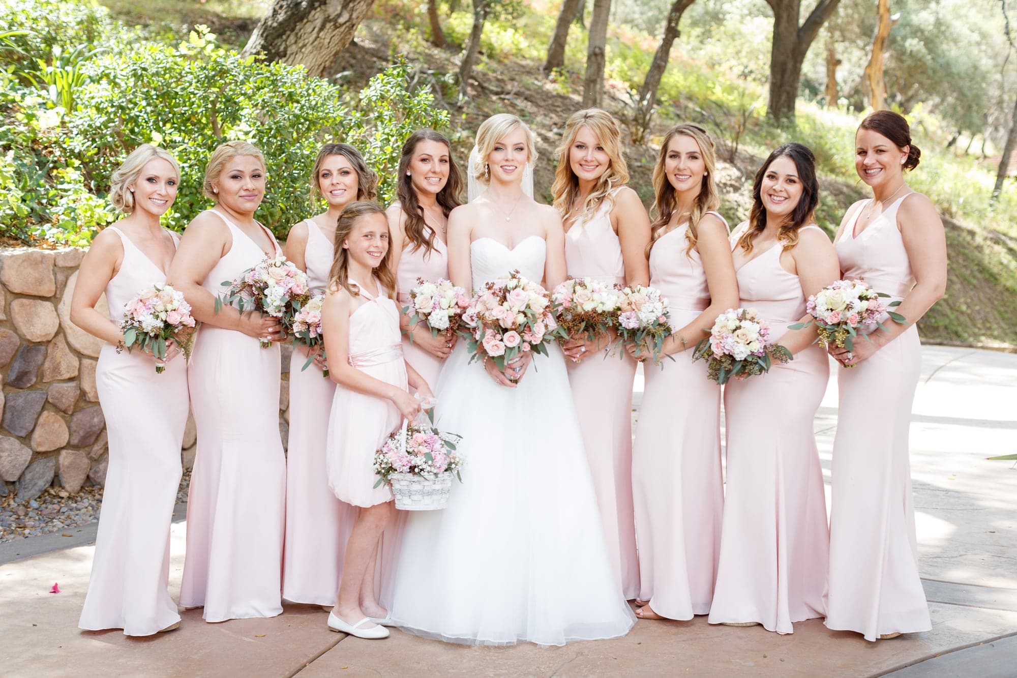 Krista with her blush dressed wedding party