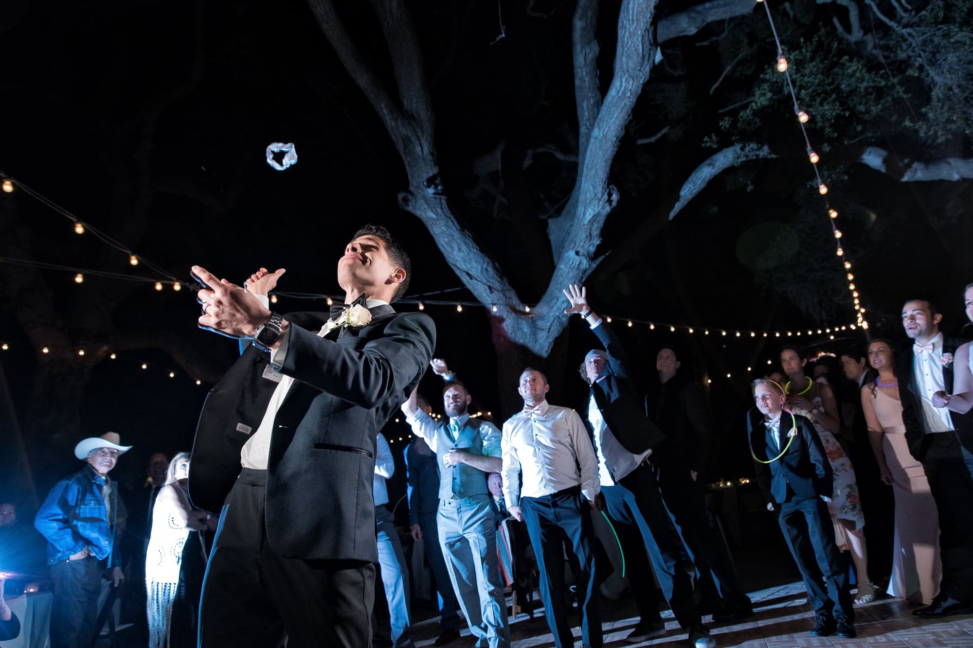 Wedding celebration beneath the trees at Circle Oak Ranch