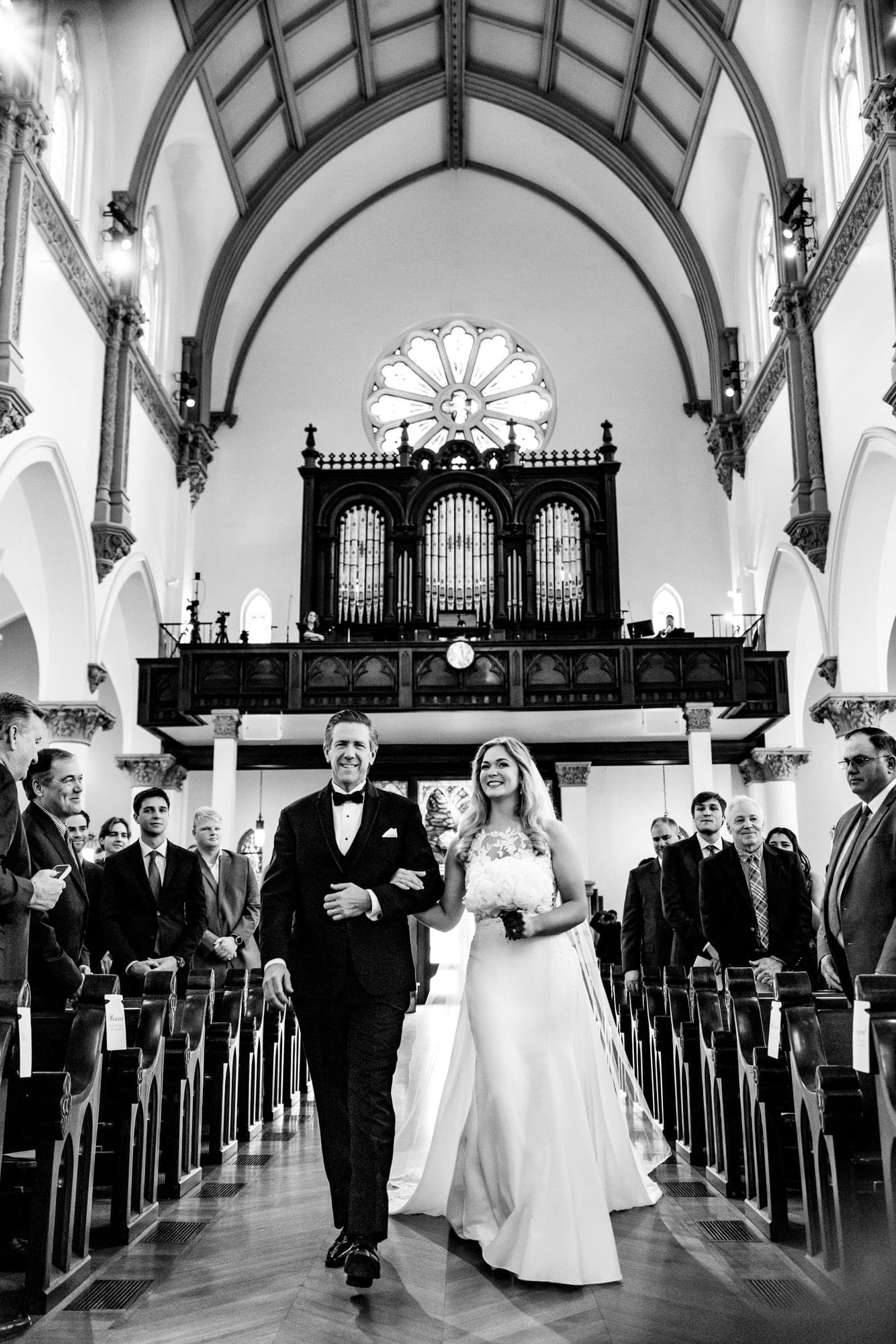 Lindsay and Jayton standing at the altar during their formal Dallas church ceremony