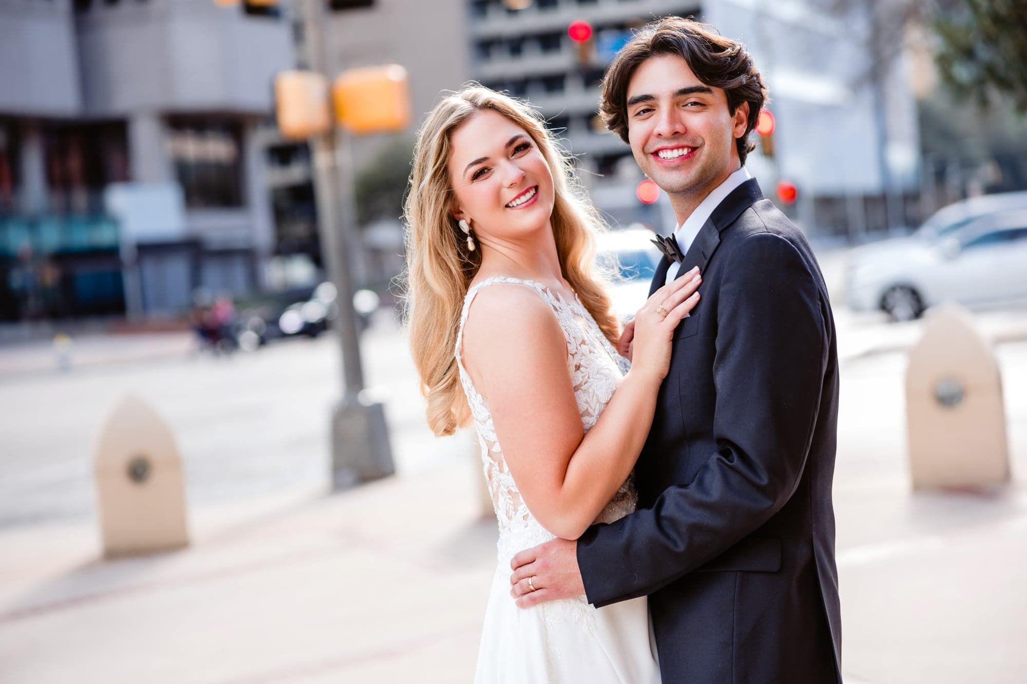Lindsay and Jayton sharing a portrait among the stone architecture of downtown Dallas