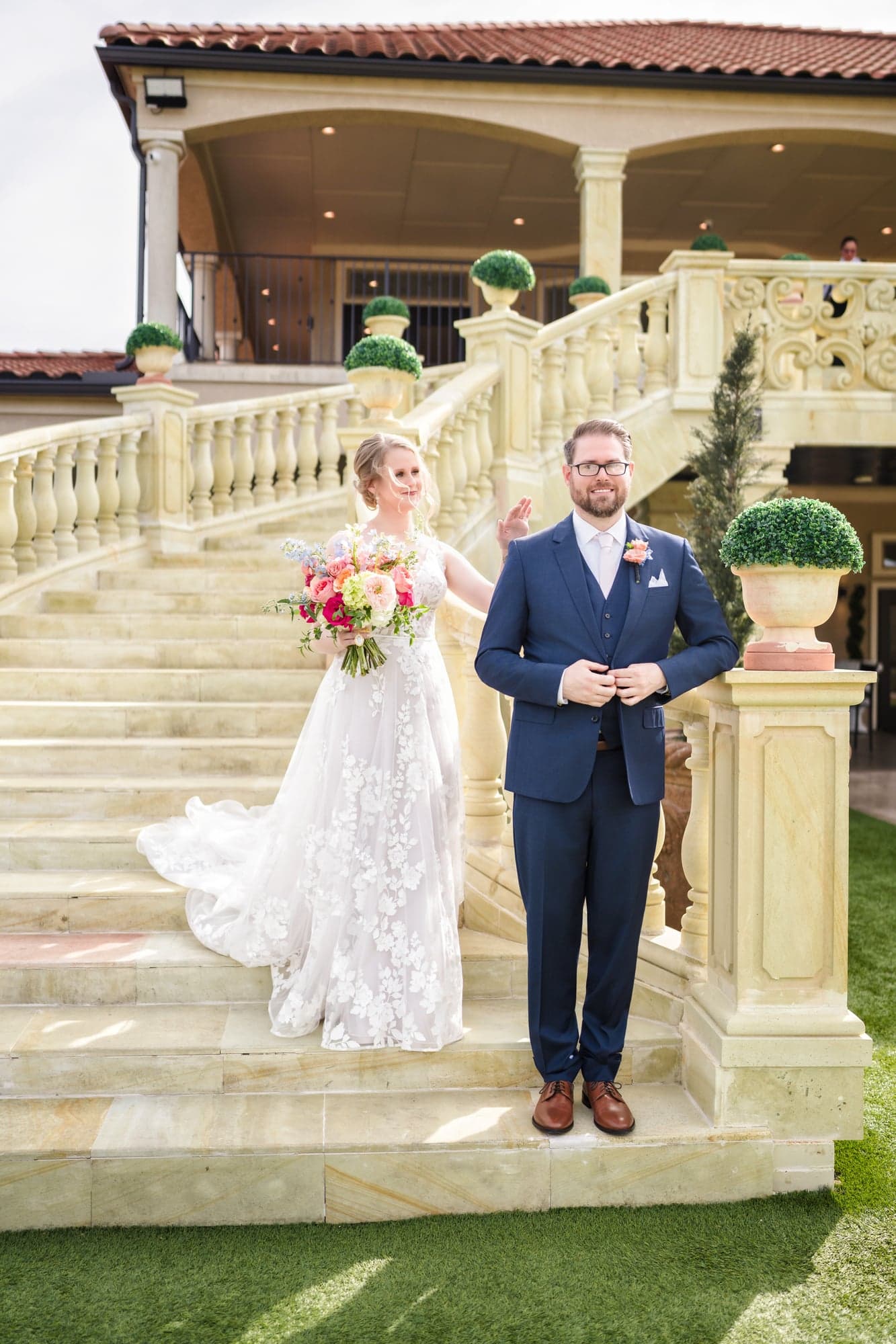Erin and Hunter together on the estate's grand staircase after their first look