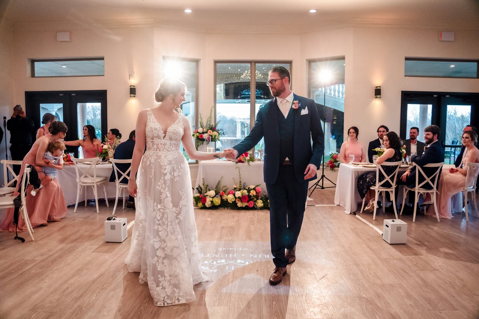 Erin and Hunter's first dance on the reception floor with guests seated around them
