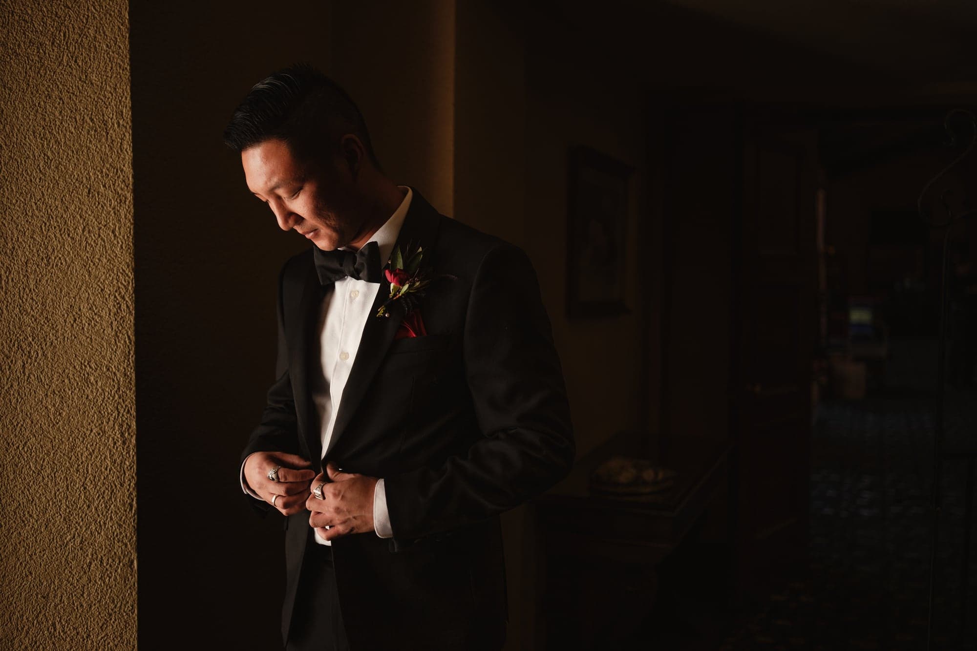 Kevin preparing in warm window light at The Ebell
