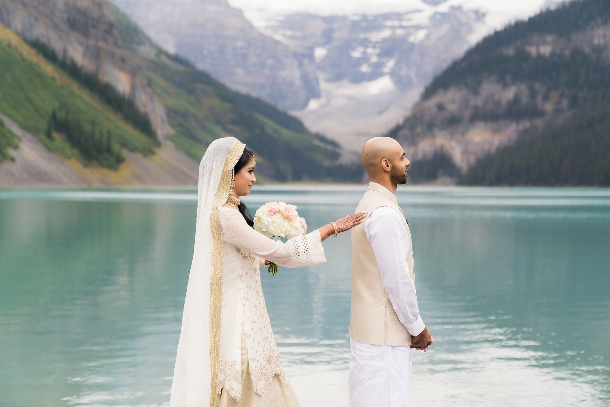 Lubna approaching Waqas for their first look beside Lake Louise