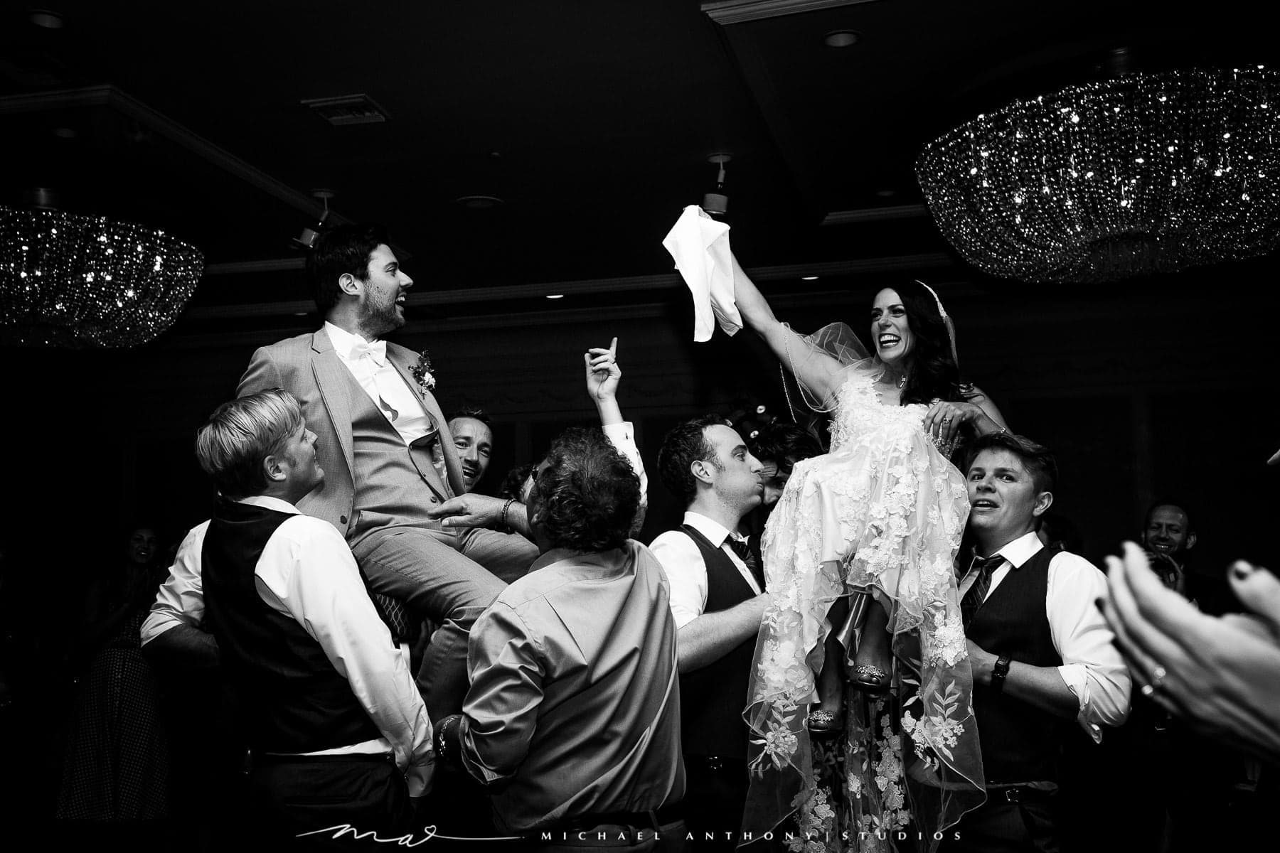Guests lifting Melissa and Gary during the reception