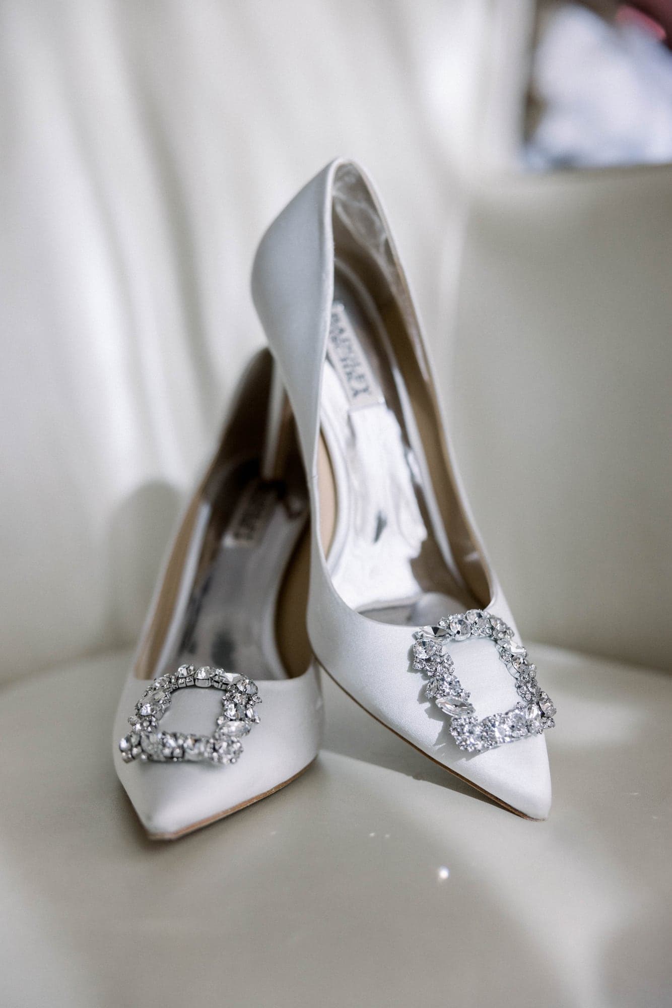 Kylie's silver wedding shoes photographed in the bright Four Seasons Las Vegas bridal suite