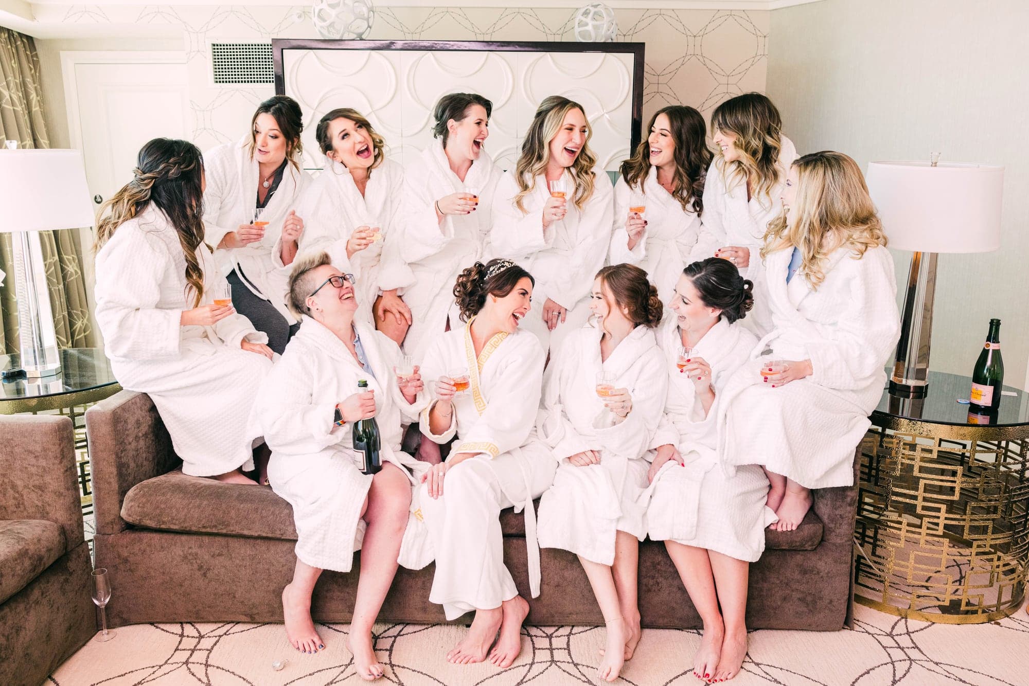 Kylie celebrating with her wedding party in matching robes before the ceremony